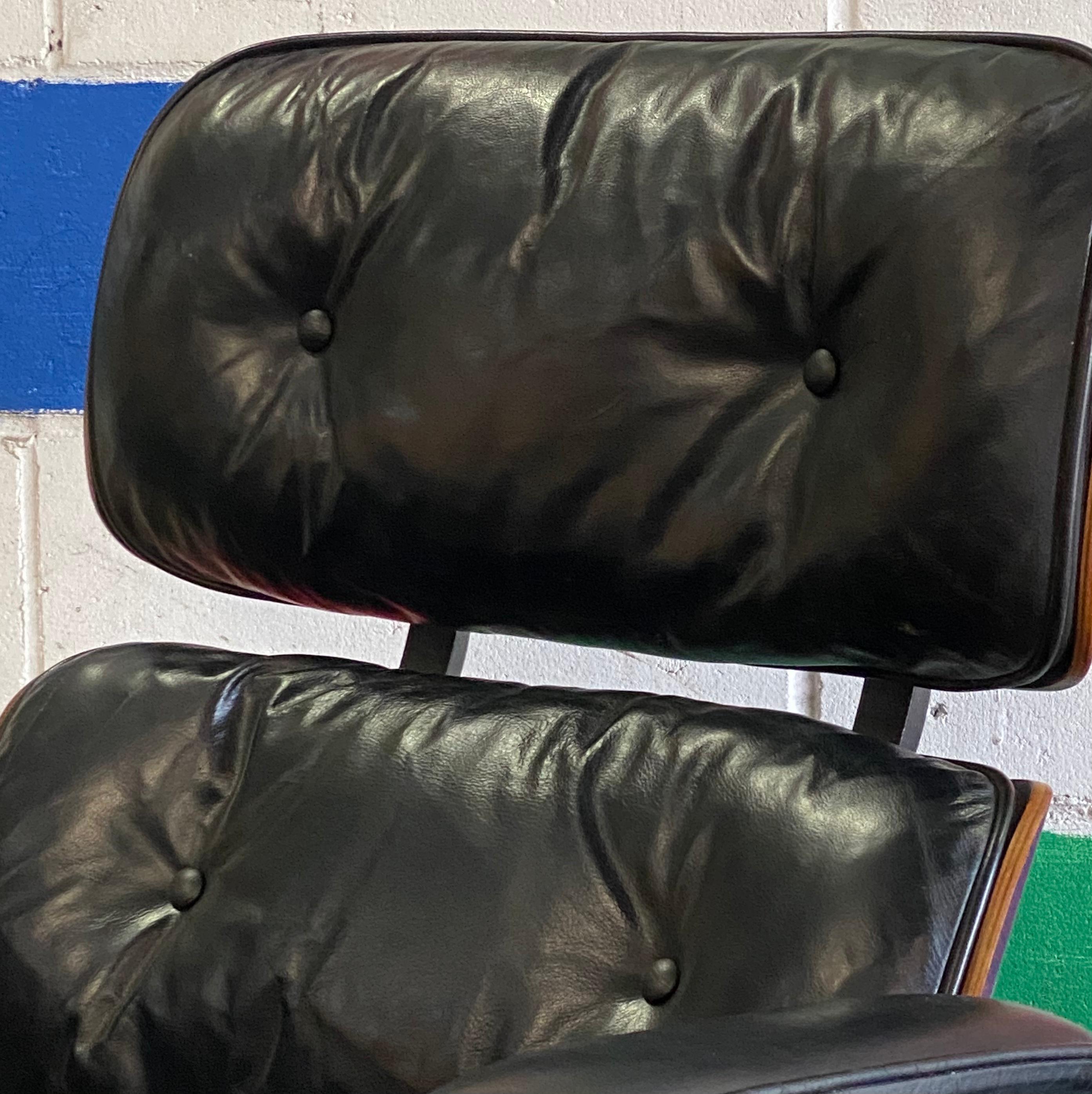 Beautiful Eames chair and ottoman by Herman Miller from the 1960s. Beautiful rosewood exterior with replaced seat shock mounts ($600 value). Original chair and ottoman pair. Black leather in good condition and all parts intact. Chair swivels and