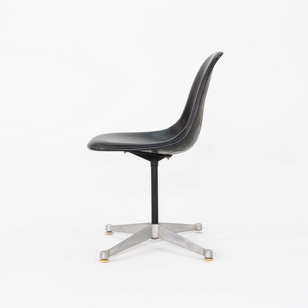 This is an Eames PSC Chair, originally designed by Ray and Charles Eames in the 1950s. This particular example was produced by Herman Miller in the USA and dates back to the 1960s. The chair features a molded fiberglass shell upholstered in black