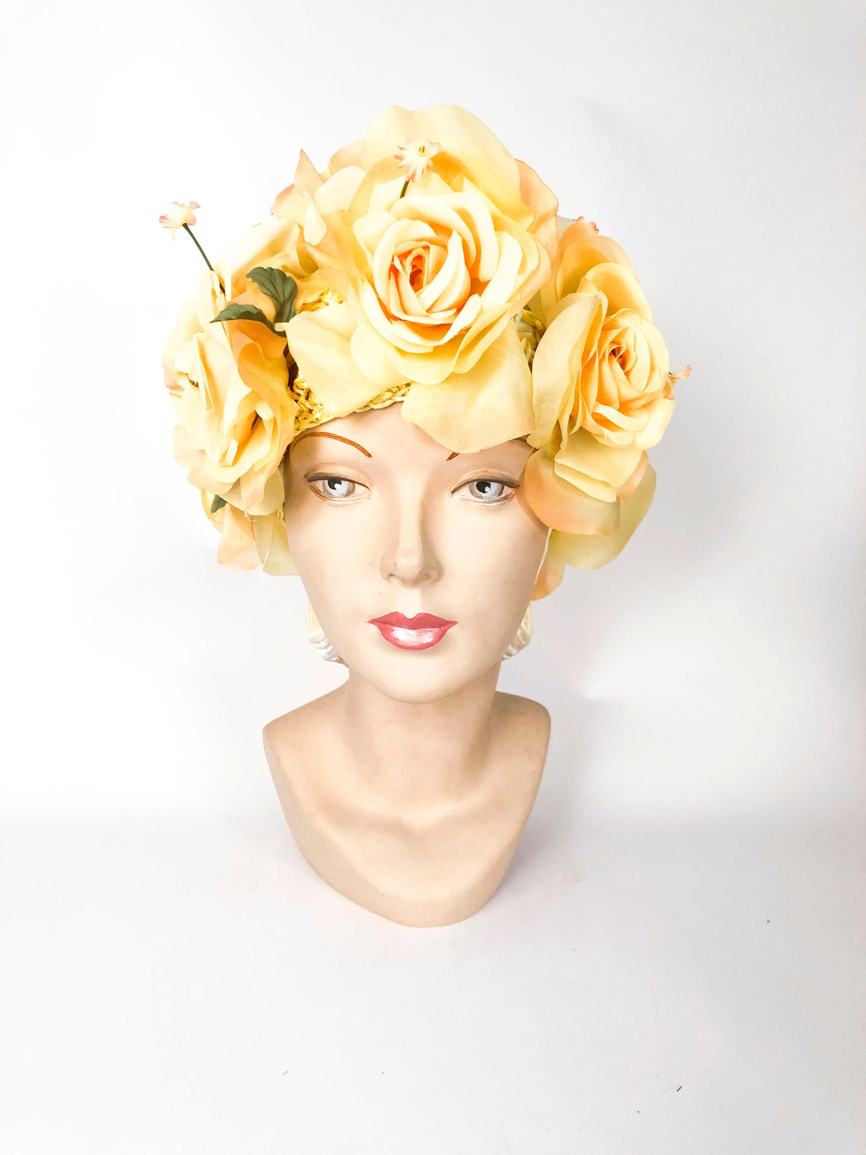 1960s High-Fashion Yellow Floral Hat with roses that have a slight peach shading that are applied on a stretch netting.