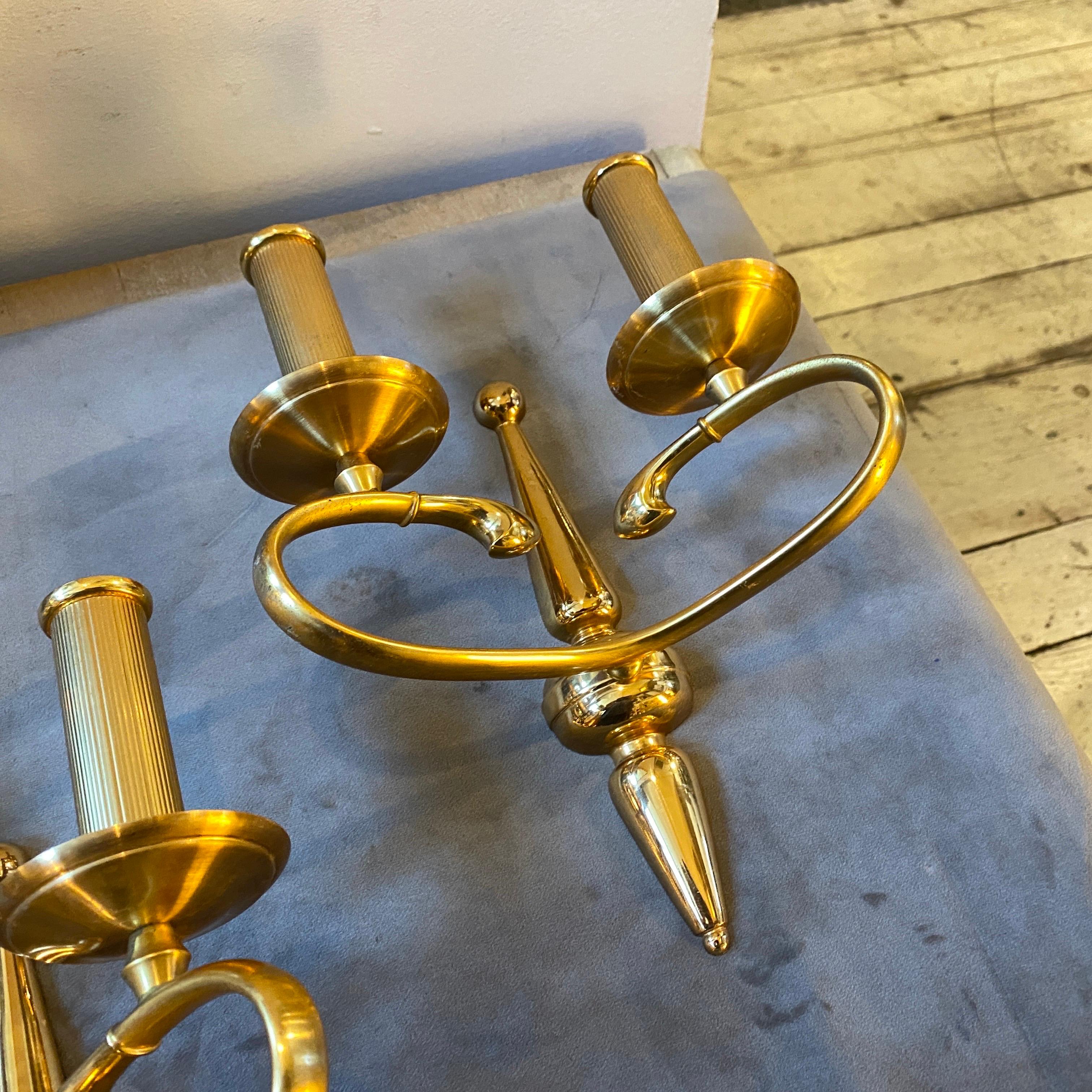 A pair of high quality solid brass italian wall sconces, they work 110-240 volts and need regular e14 bulbs. The brass original patina gives them a vibrant vintage look.