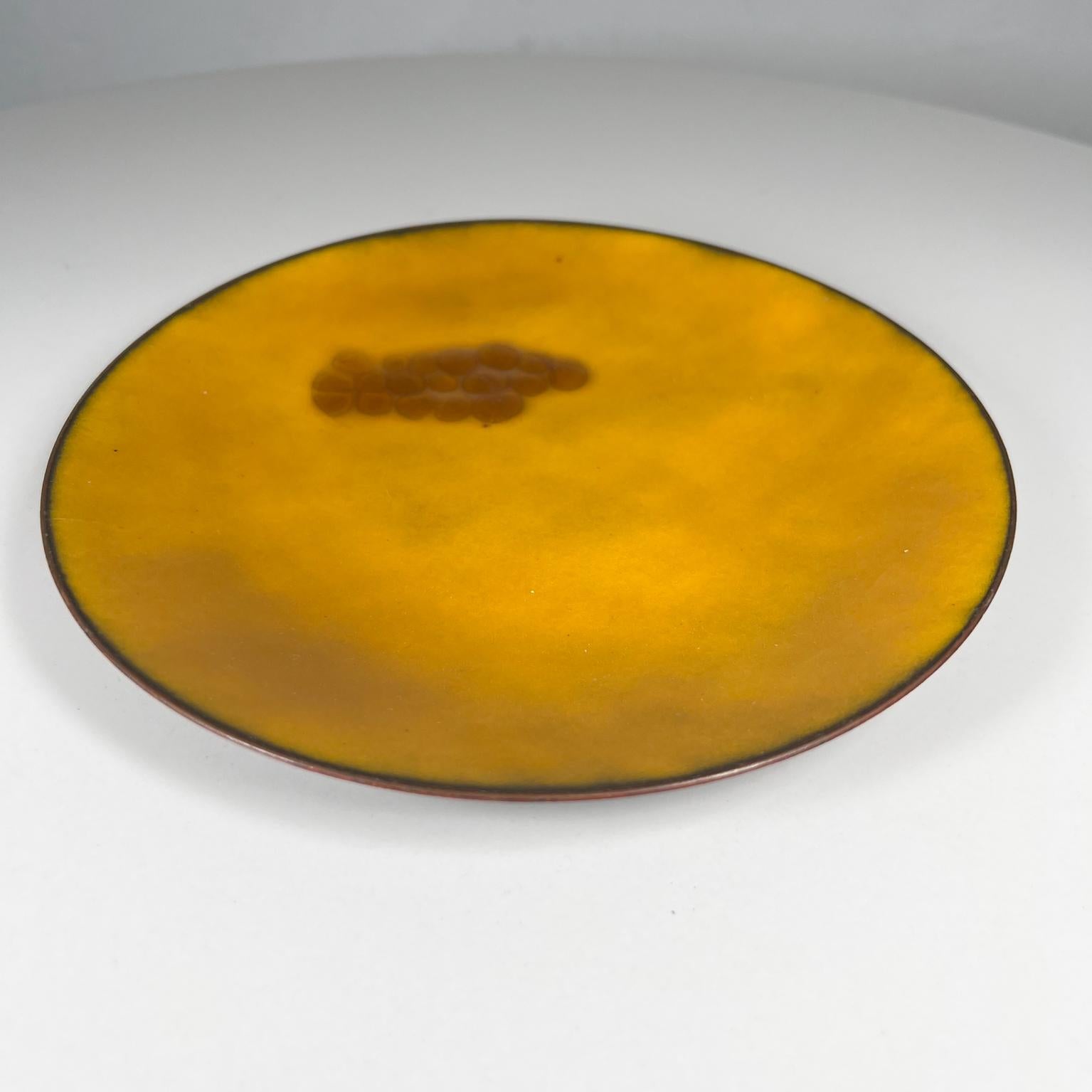 1960s Hildegard abstract modernist art yellow copper enamel plate with Grapes 
Signed art Hildegard.
Measures: 7.75 diameter x .75 d
Preowned original vintage condition
Refer to images.