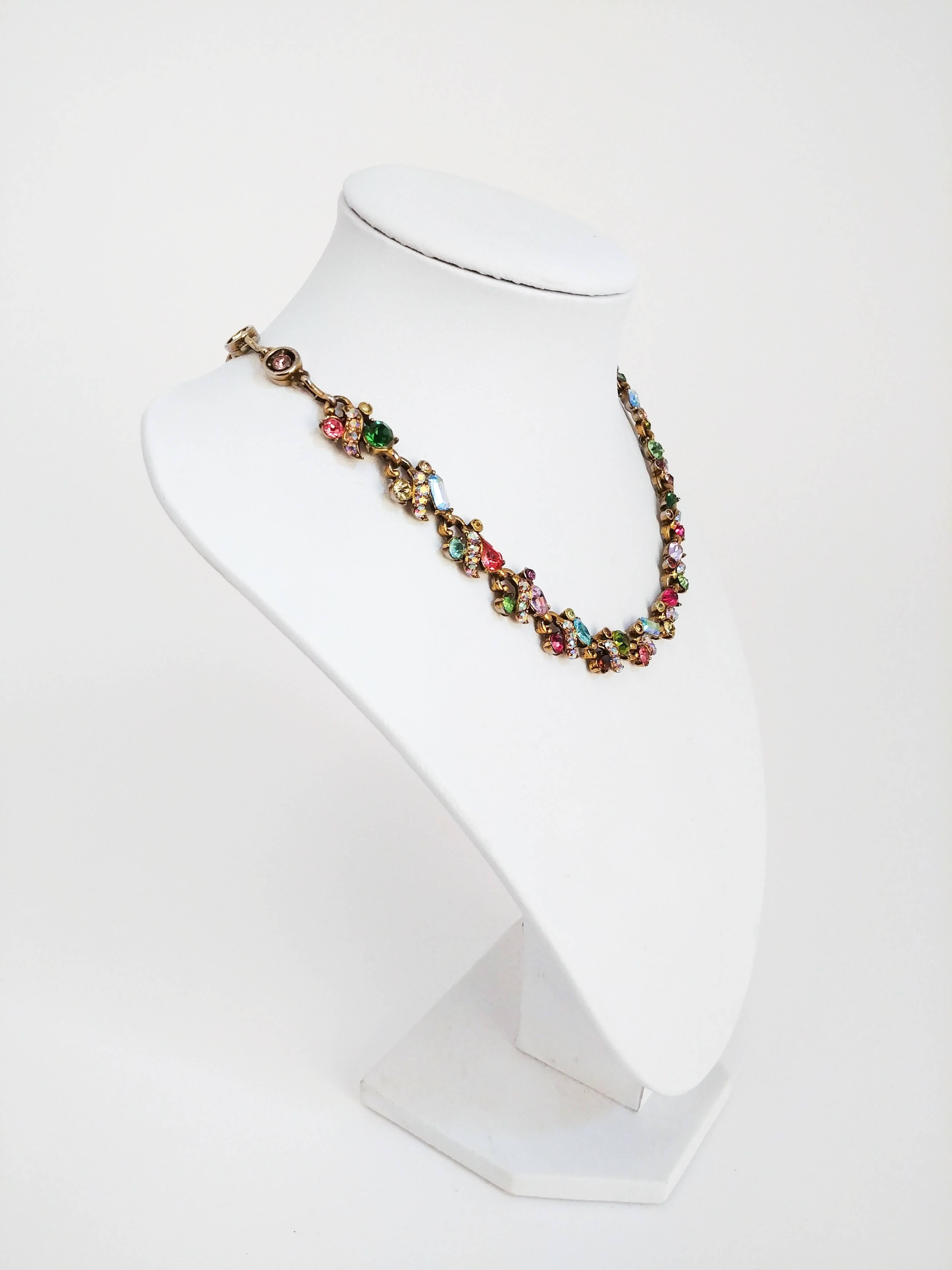 1960s Hollycraft Rainbow Rhinestone Necklace. Gold tone linked necklace with multi-color and multi-cut rhinestones. Adjustable hook clousre. 15 to 19 inches in length. 