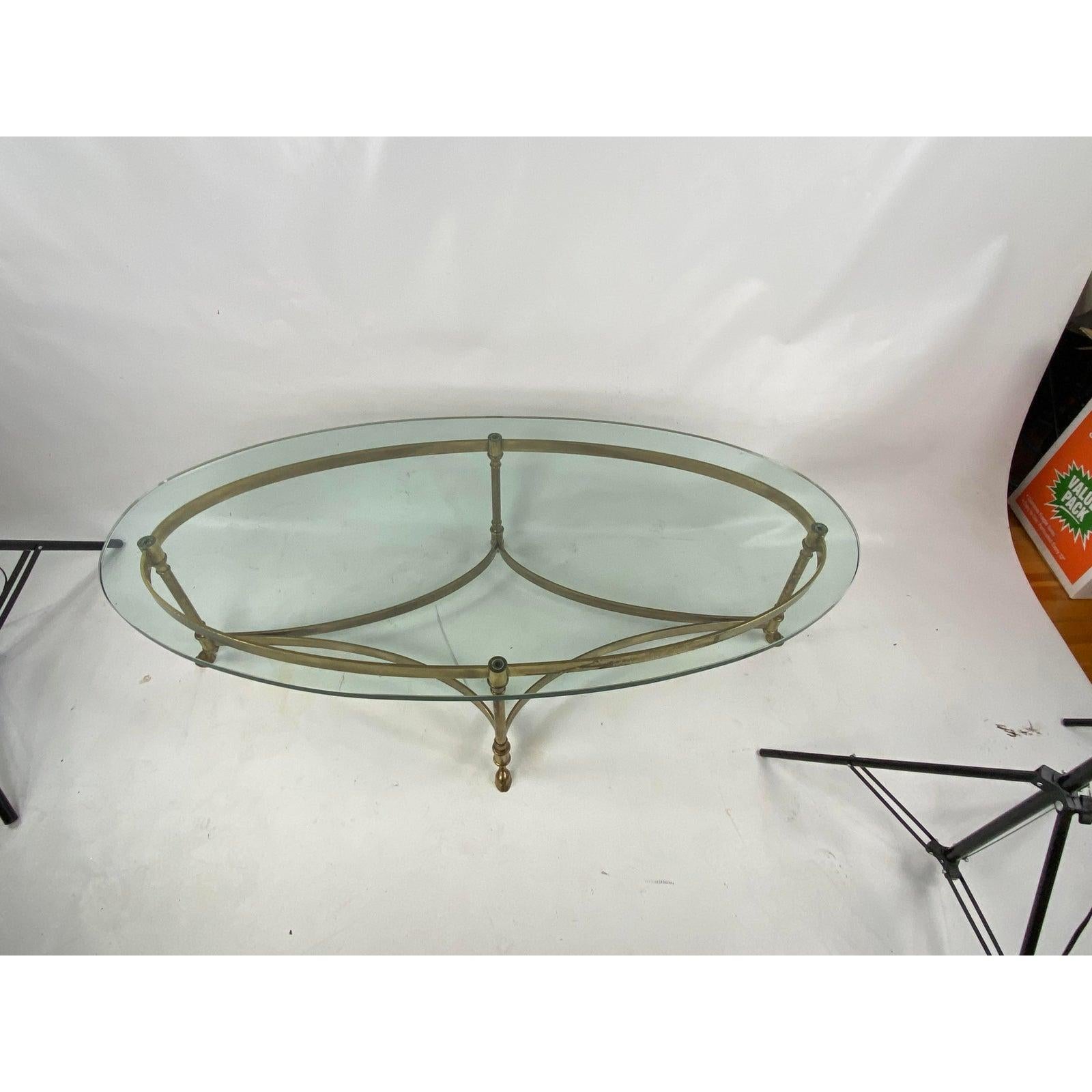 Brass cocktail table with hoofed feet by LaBarge. Made in the 1960s.