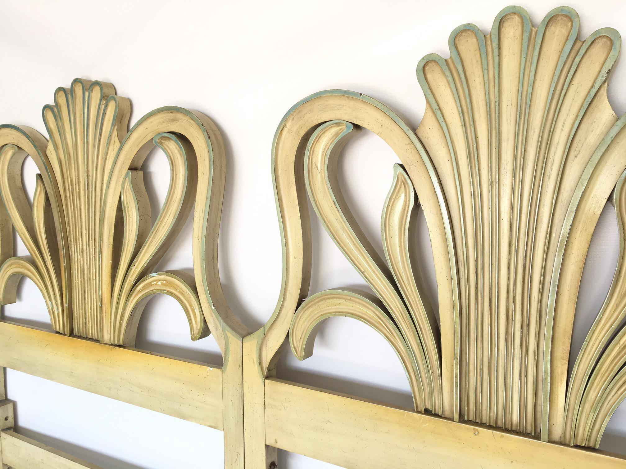 Highly carved Art Nouveau style king-size headboard in the manner of Dorothy Draper. Headboard was factory made as two twin headboards mounted together. Could be taken apart and used as two separate twin size headboards, or used as a king as