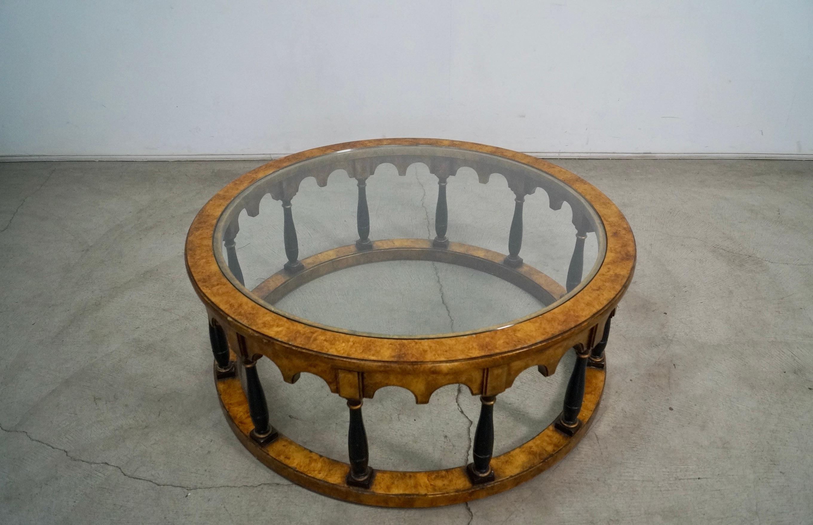 Vintage Mid century round coffee table for sale. From the 1960's, and very rare and beautiful. Has a gold leaf finish on the wood with black accents and gold. It's a very unique table that is very solid and well made. It's in excellent vintage