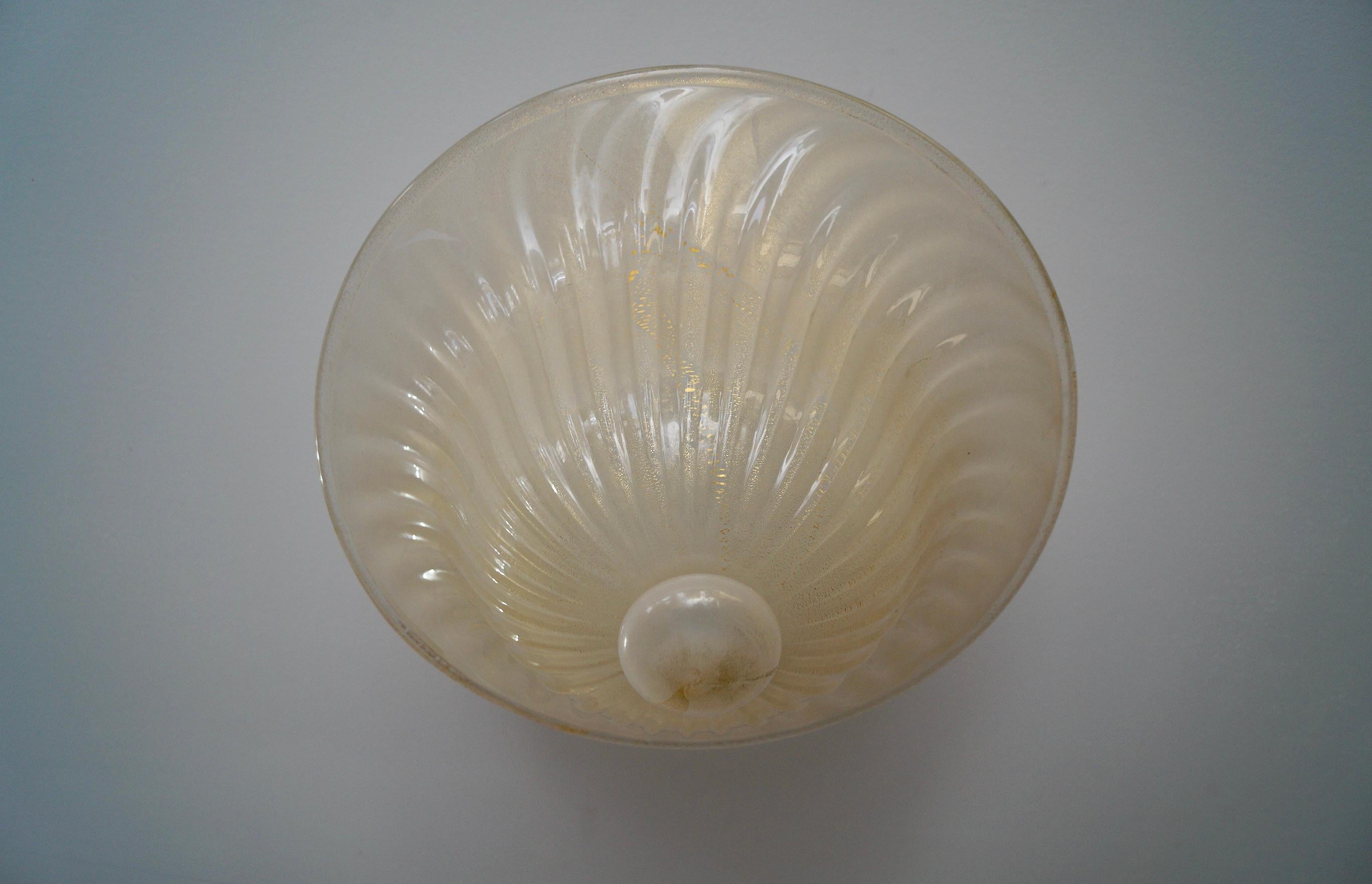 Vintage 1960s Murano glass ceiling lamp for sale. Very beautiful, and in excellent condition with no chips or deep scratches. Made of thick glass with gold specks. It's a rare Italian lamp, and very beautiful. Would make any room elegant. Has two