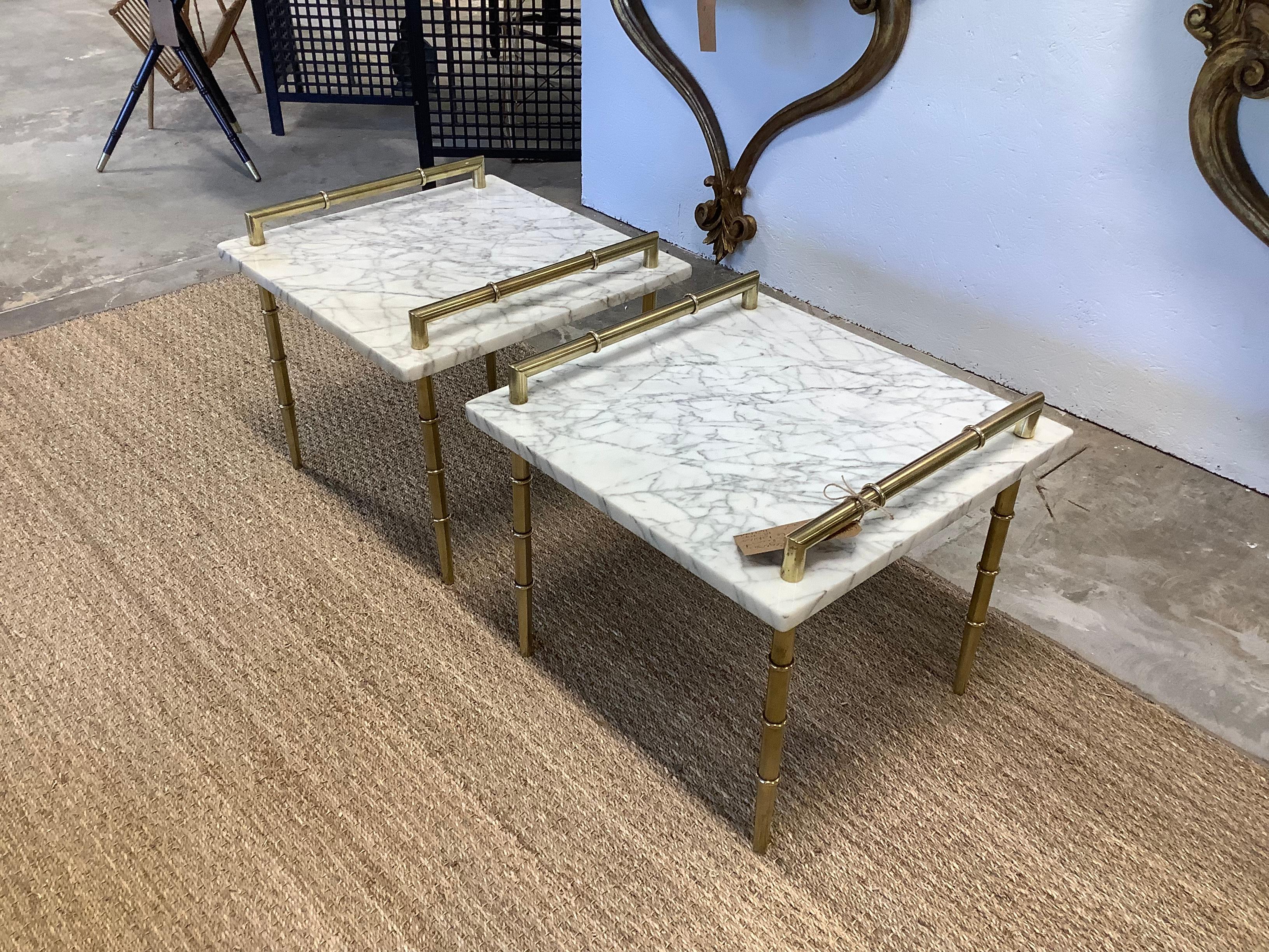 Very handsome and classic pair, of Hollywood Regency tables, in brass and marble. Clean lines, sturdy and practical. Could be used together, as a small coffee table. Seperately can be used as side tables, end tables. The height of the tables is 18”,