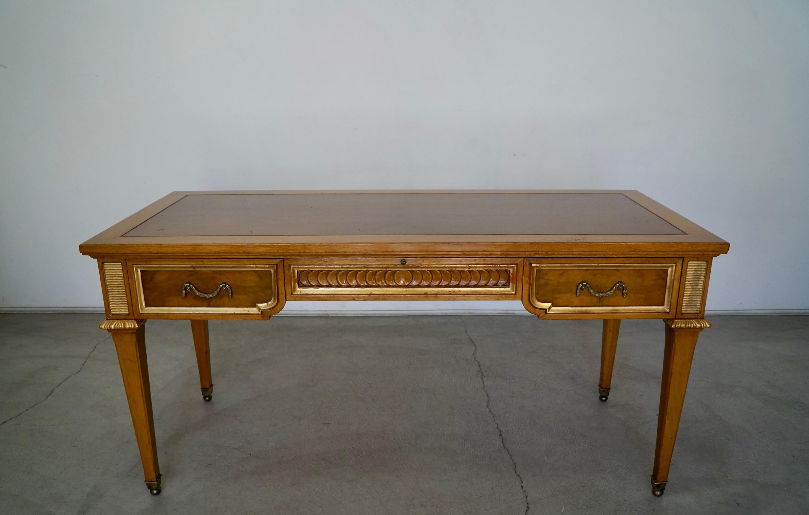 Vintage 1960s Hollywood Regency desk for sale. Manufactured by Karges in the 1960s, and in beautiful vintage condition. Really special writing desk that is really solid and well made. Has a flaming mahogany top with burl with drawers, sides, and
