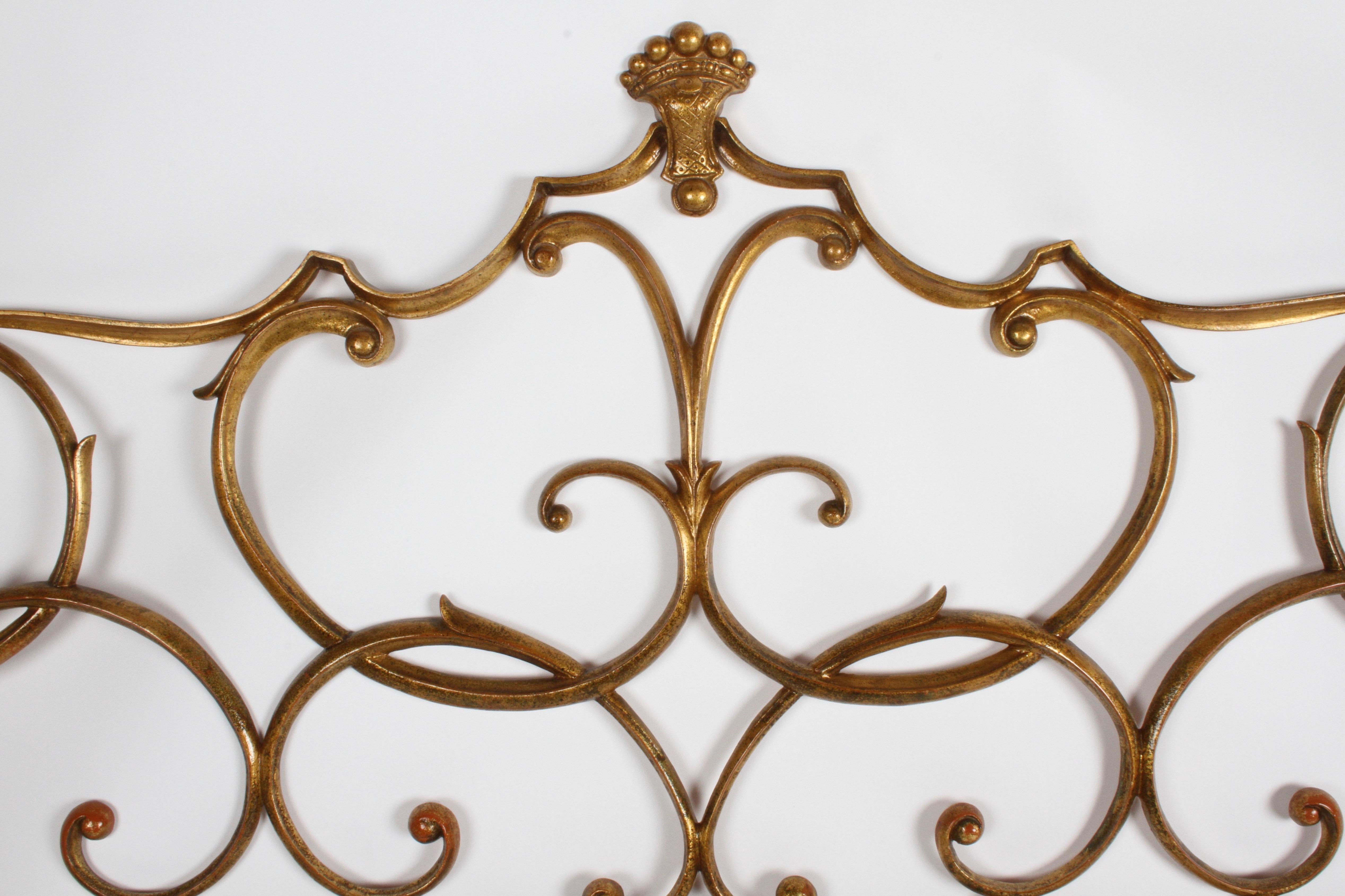 Very Hollywood Regency, Italian Rococo style King headboard with gold gilt. Cast metal, appears to have original gold paint over orange, made in Italy. In very nice condition, very little wear, no breaks. Glamorous!! Mounting hardware is 75.5