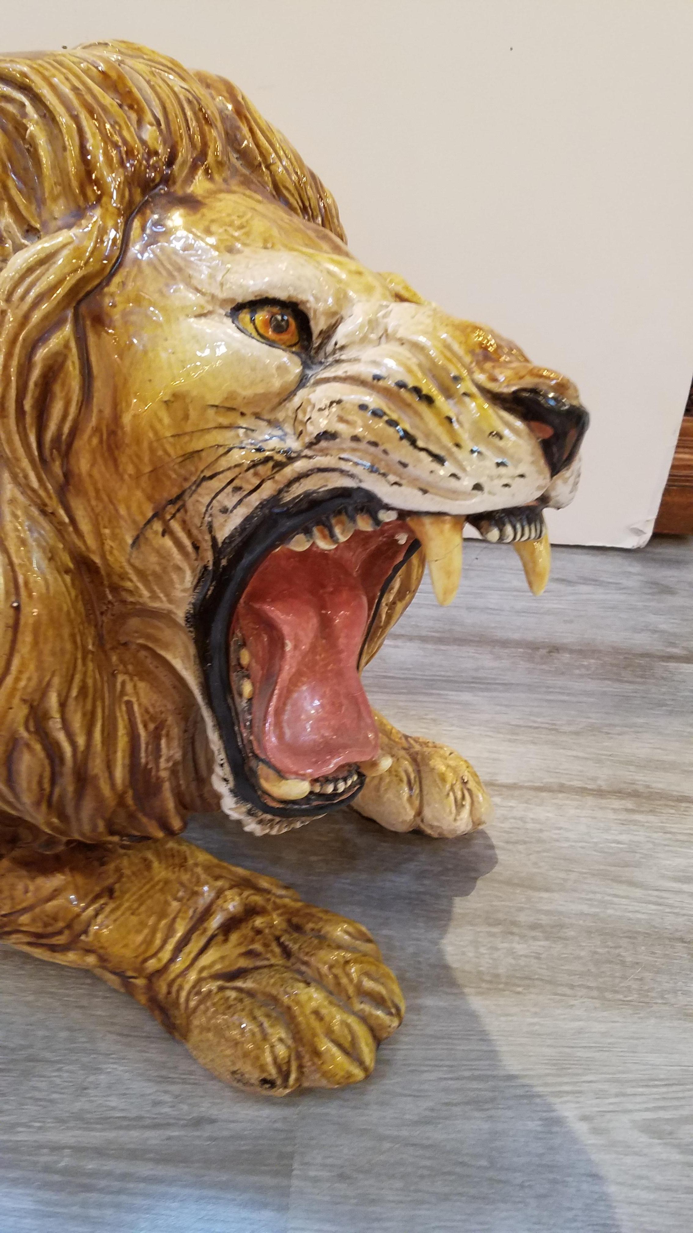 Wonderful large size roaring loin sculpture signed with an impressed mark on the underside 