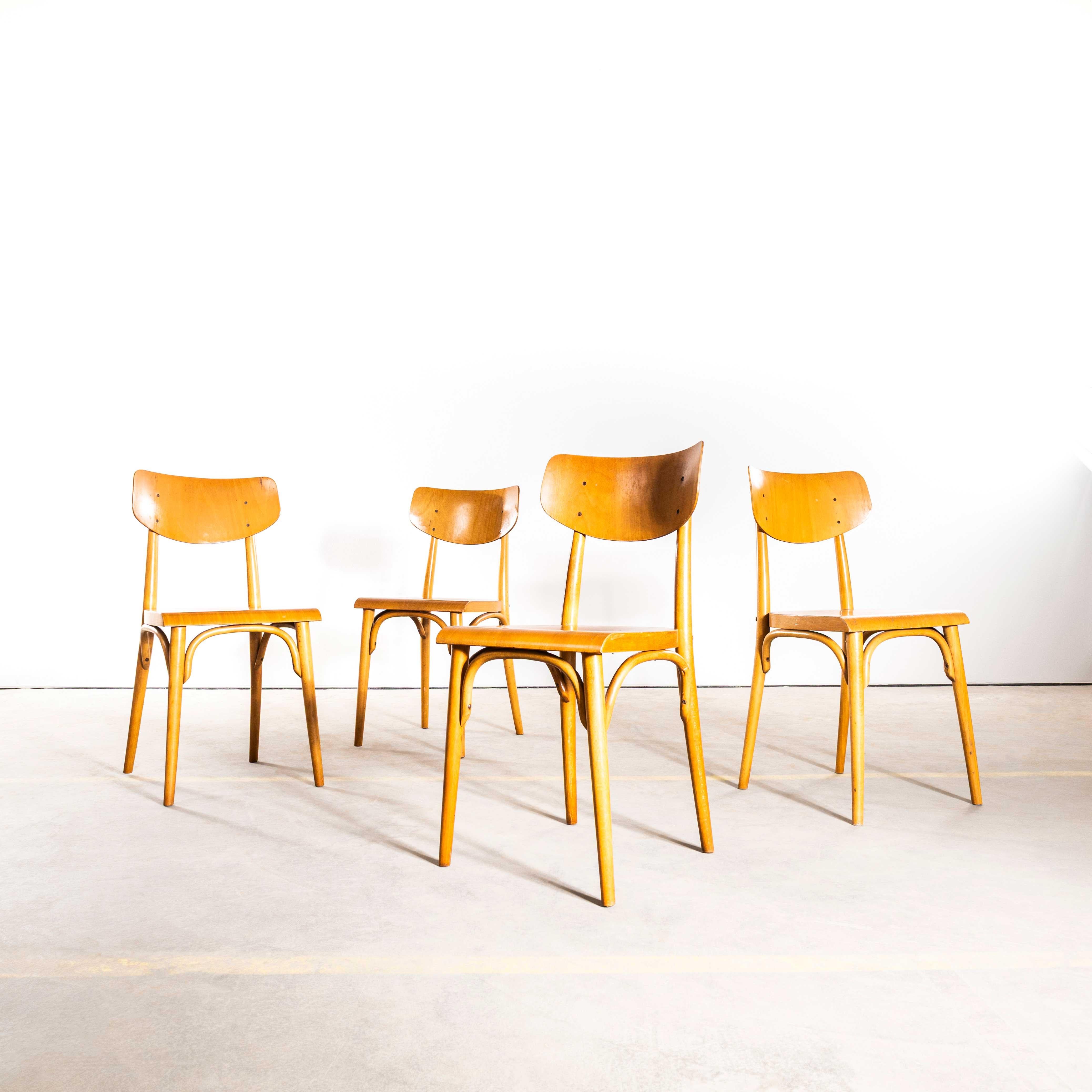 1960’s Honey Glossed Shield Back Dining Chairs – Set Of Four. 
1960’s shield back chairs, good quality classic bentwood chairs with a simple contemporary shape and in clean contemporary honey blonde colour. The chairs were made in Eastern Europe by