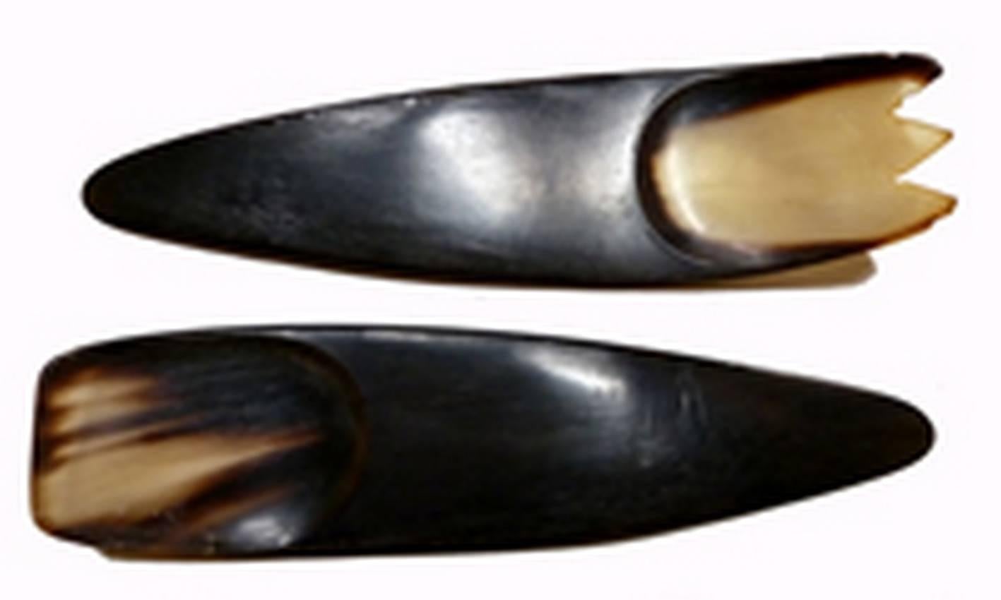 Pair of carved horn serving utensils by Austrian designer Carl Aubock dating from the 1960s. One piece has teeth like a fork and the other can be used like a spoon.

The Werkstätte Carl Auböck is a fourth-generation Viennese workshop known for its