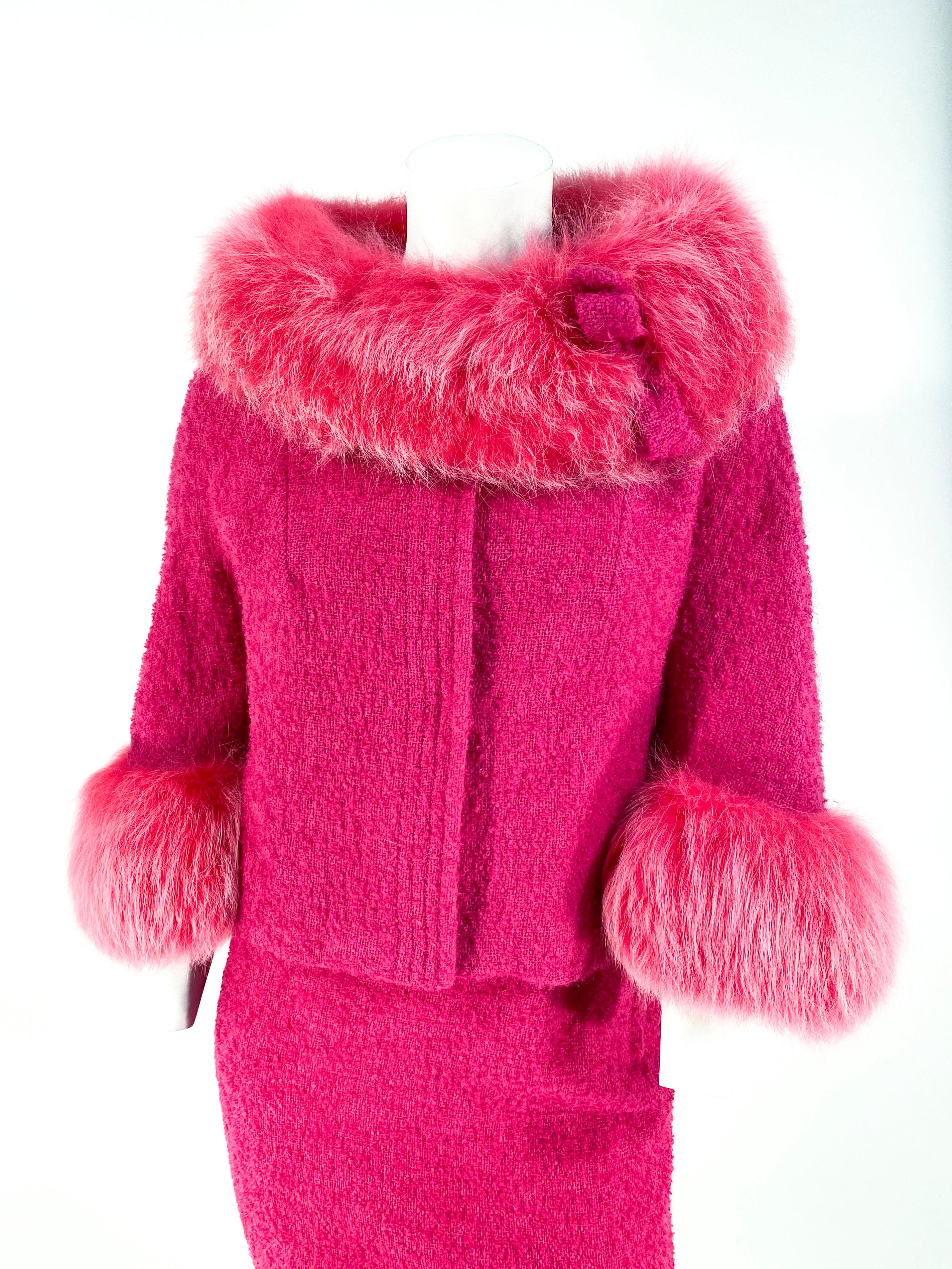 1960s custom made and custom dyed hot pink mohair suit with fox collar and cuffs. The full fox collar has a mohair bow detail to match the rest of the suit. The hidden snap closures are hand-covered with matching silk and the skirt is fully-lined