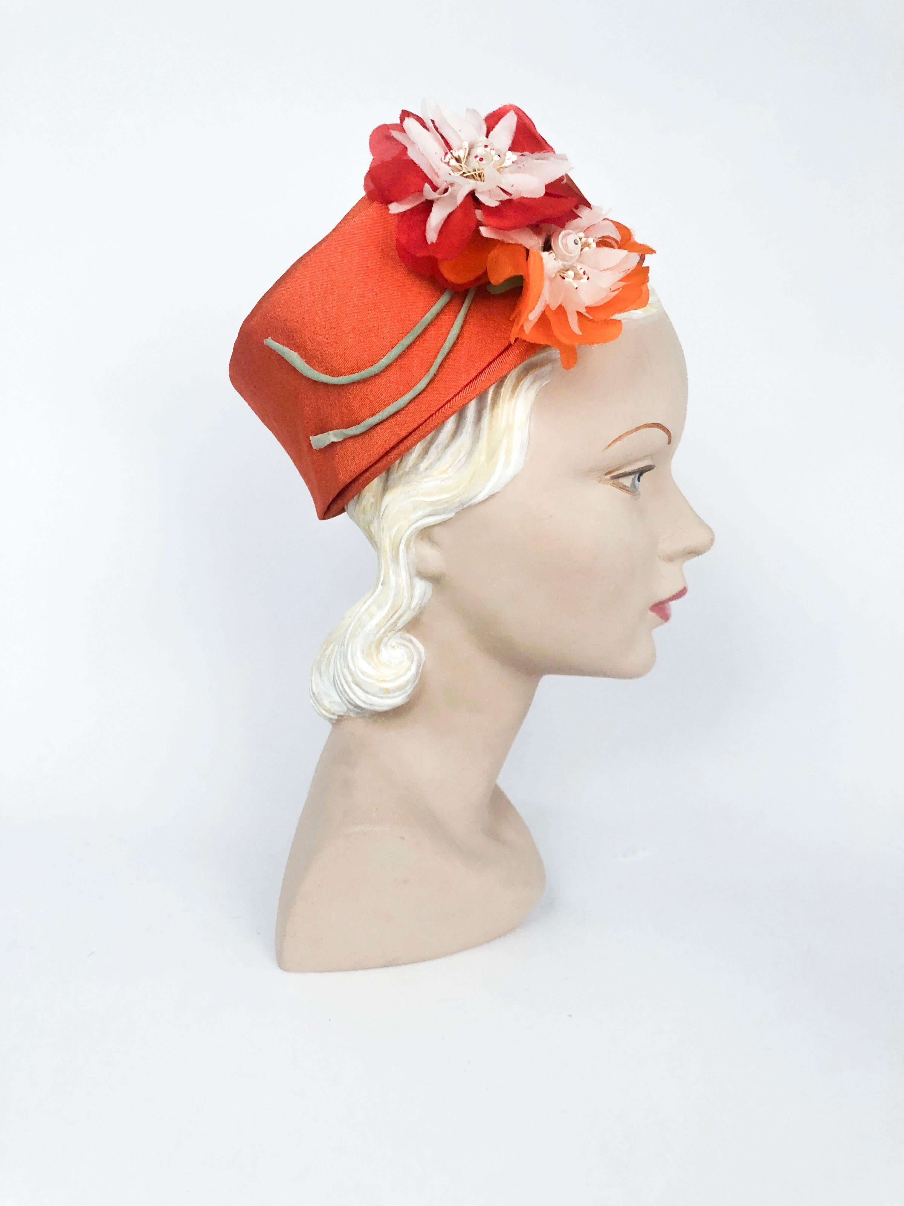 1960s I. Magnin Orange Pillbox Hat with Floral and Seashell Accents at