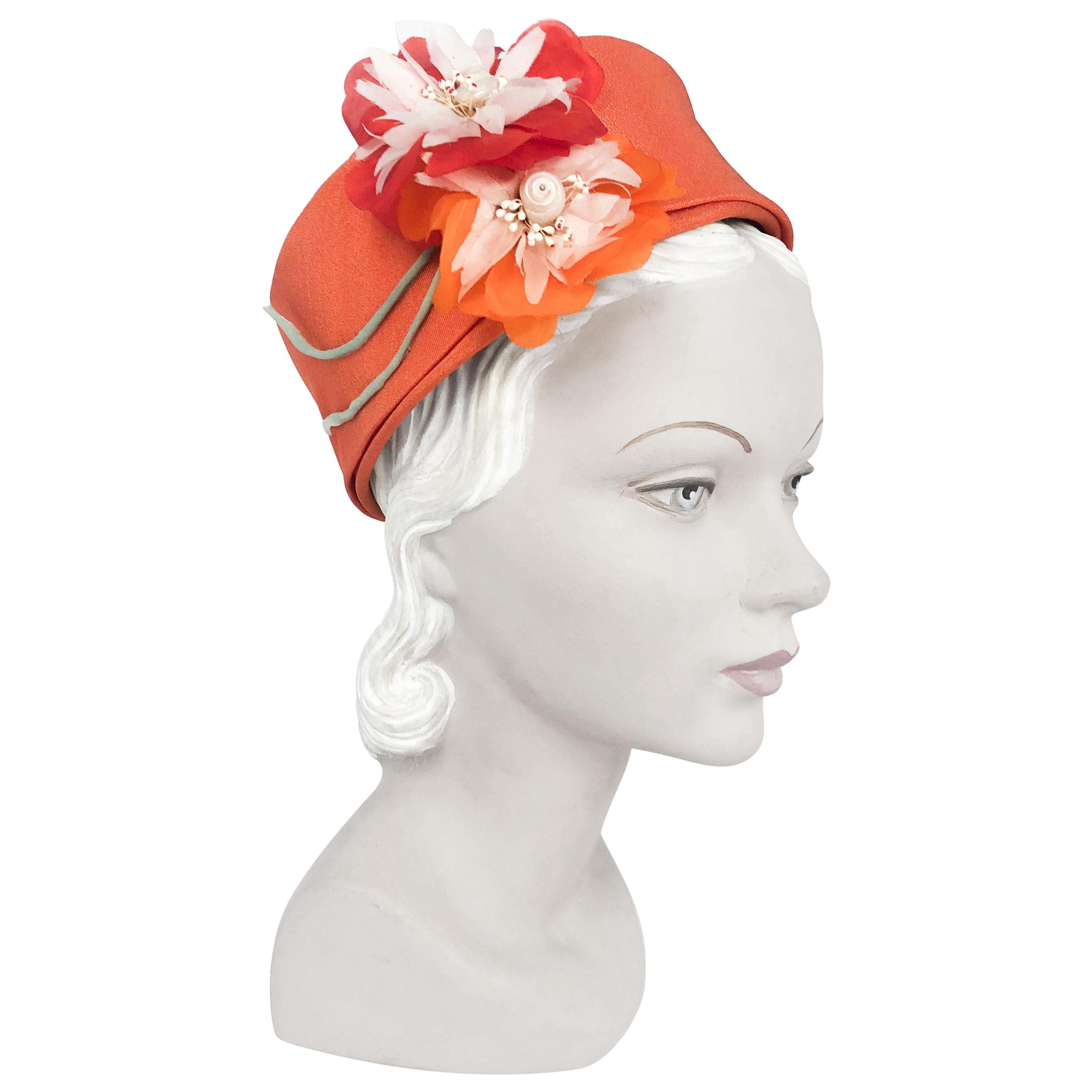 1960s I. Magnin Orange Pillbox Hat with Floral and Seashell Accents at