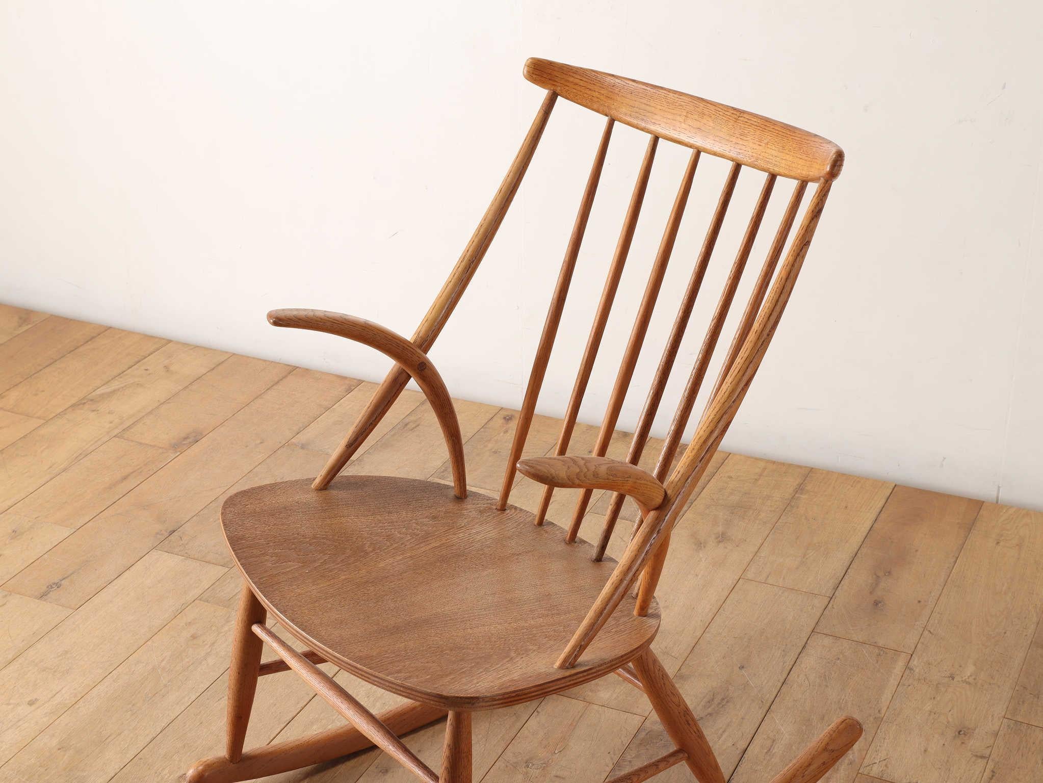 Rocking chair designed by Danish designer Illum Wikkelso, a qualified joiner by trade. He has left behind some masterpieces of furniture that incorporate the fingerwork technique of joining wooden planks together without the use of nails in their