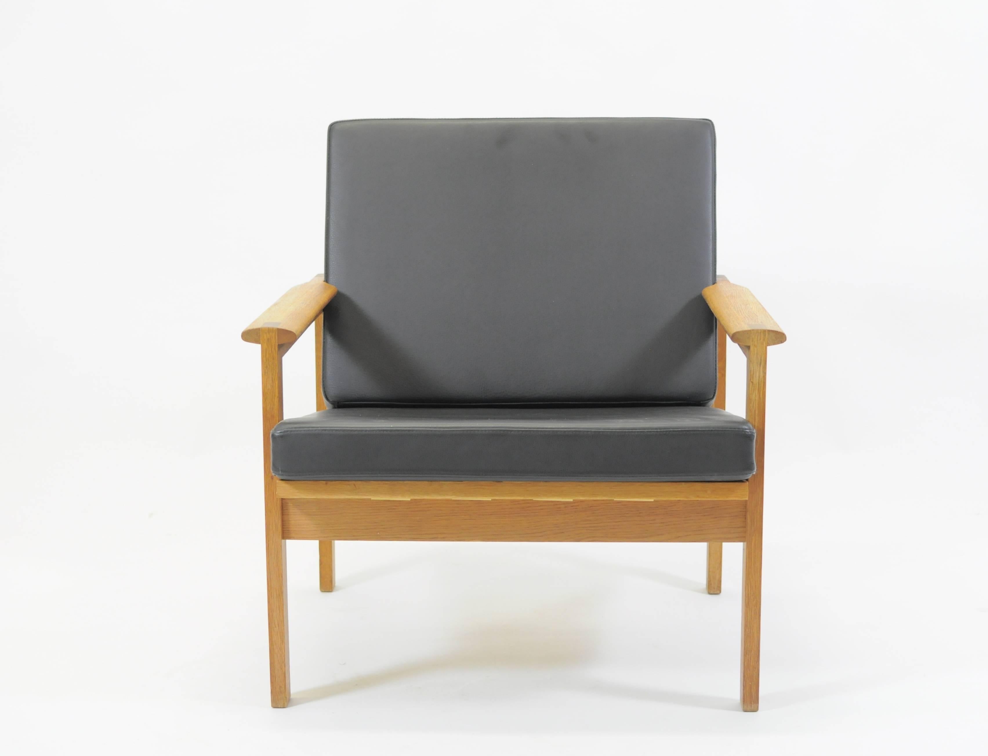 Set of two fully restored Capella lounge chairs in oak designed by Illum Wikkelsø in 1959 and produced by N. Eilersen in the 1960s. 

The Capella lounge chairs have been fully restored and refinished by our cabinetmeaker to ensyre that they are in