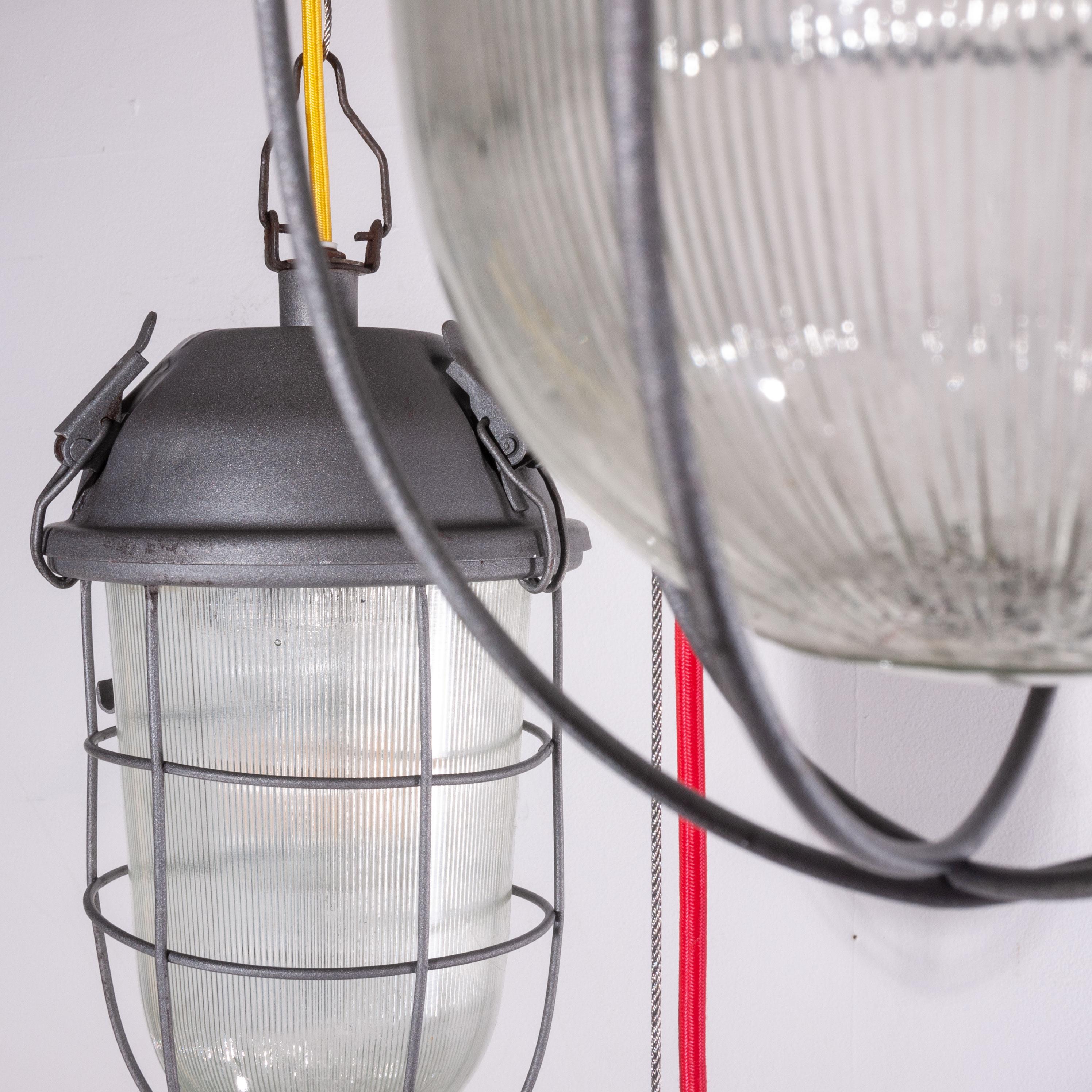 1960s industrial caged hanging ceiling pendant lamps/lights with original glass – Various quantities available
1960s vintage industrial caged hanging ceiling pendant lamps/lights with original glass. We have a large number of these stunning caged