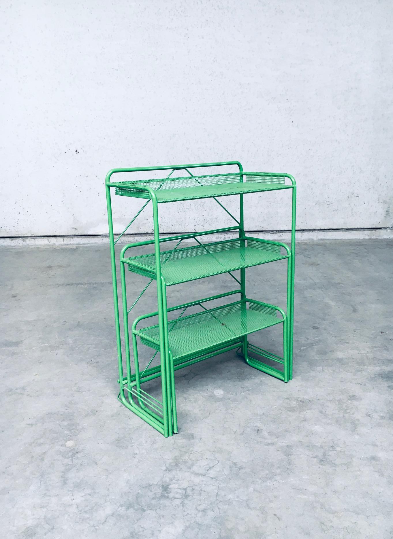 Industrial Design Green Lacquered Perforated Metal Plant Stand. Made in France, 1960's / 70's period. Green lacquered perforated steel sheets and metal wire constructed plant stand with 2 pull out levels on gliders. Well designed and constructed