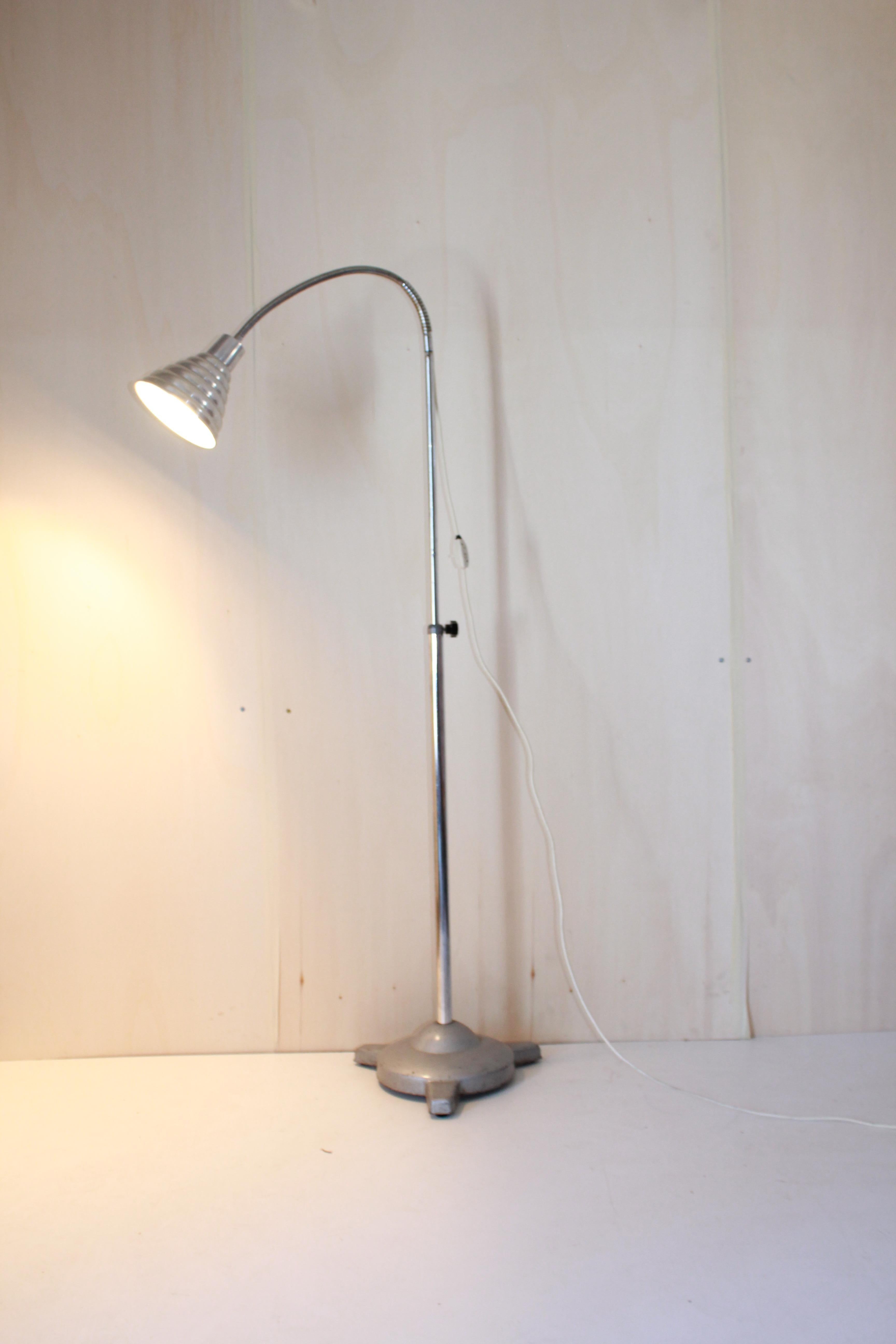 Vintage flexible Floor Lamp, Industriak style, Italy 1960s
A cosy 1960's industrial floor lamp with flexible light spot and adjustable iron pole. Model of lamp usually used in doctor studios.

E 27 light bulb. In very good conditions with only few