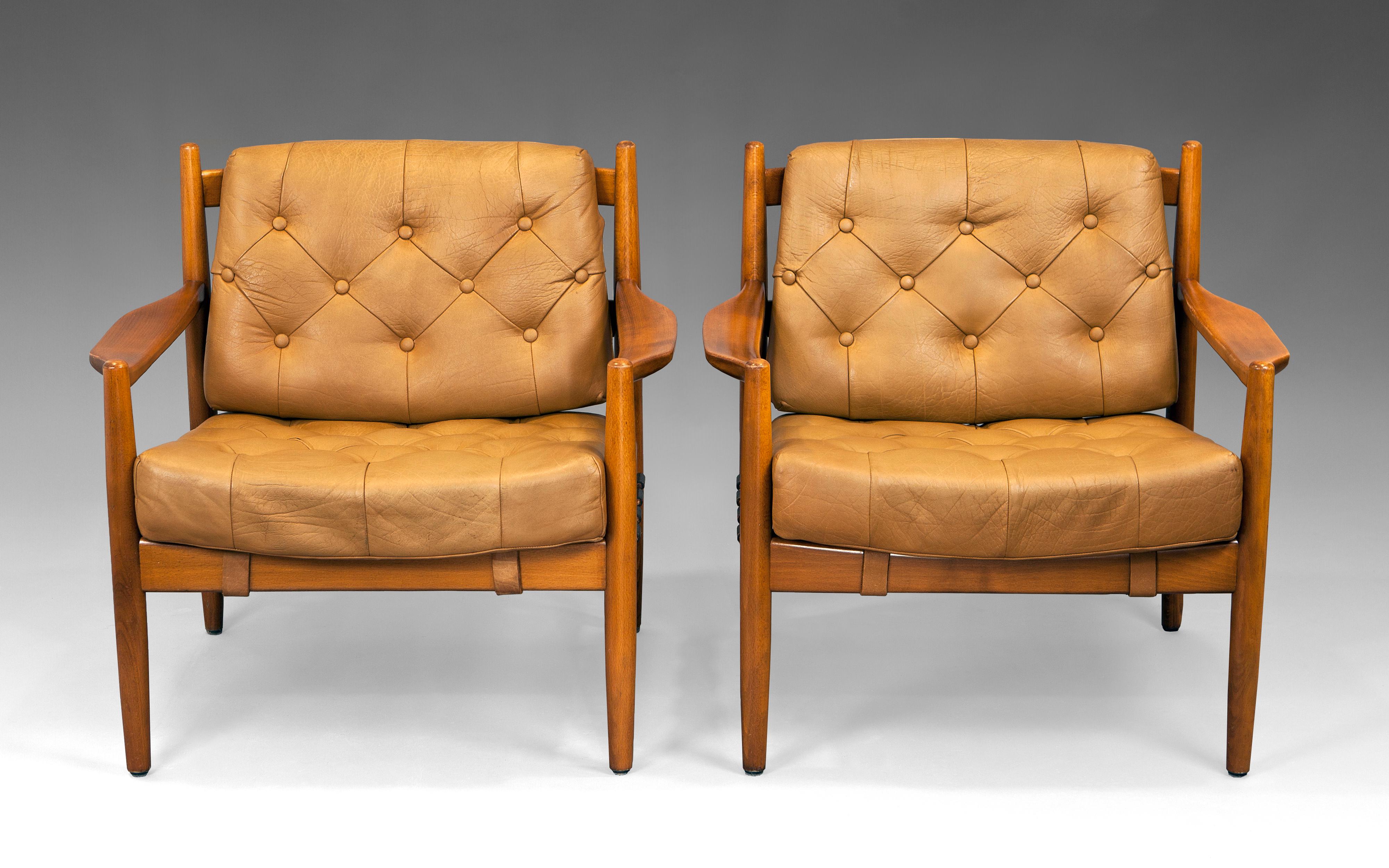 Mid Century modern design, “Läckö” pair of armchairs by Swedish designer Ingemar Thillmark. Manufactured by OPE möbler. Sweden 1960s. Stained beech frame. Deep padded seats dressed in leather with use patina.

Fully restored wooden structure and