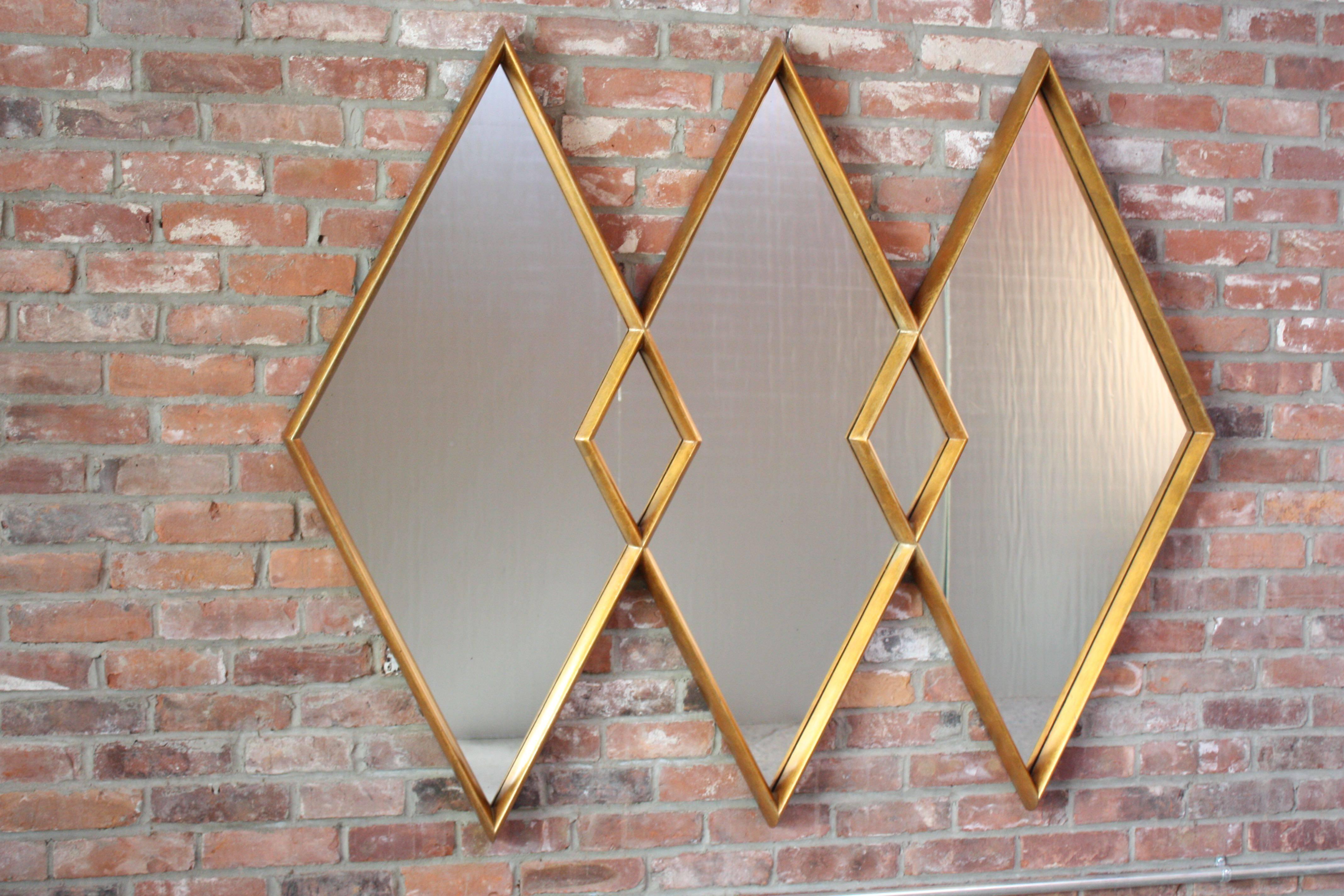 Regal Labarge mirror composed of three interlocking diamonds of inset electro copper mirror glass framed by giltwood. Minor, age-appropriate wear / patina to the frame. Few black specs toward bottom of glass, as the second to last photograph shows.