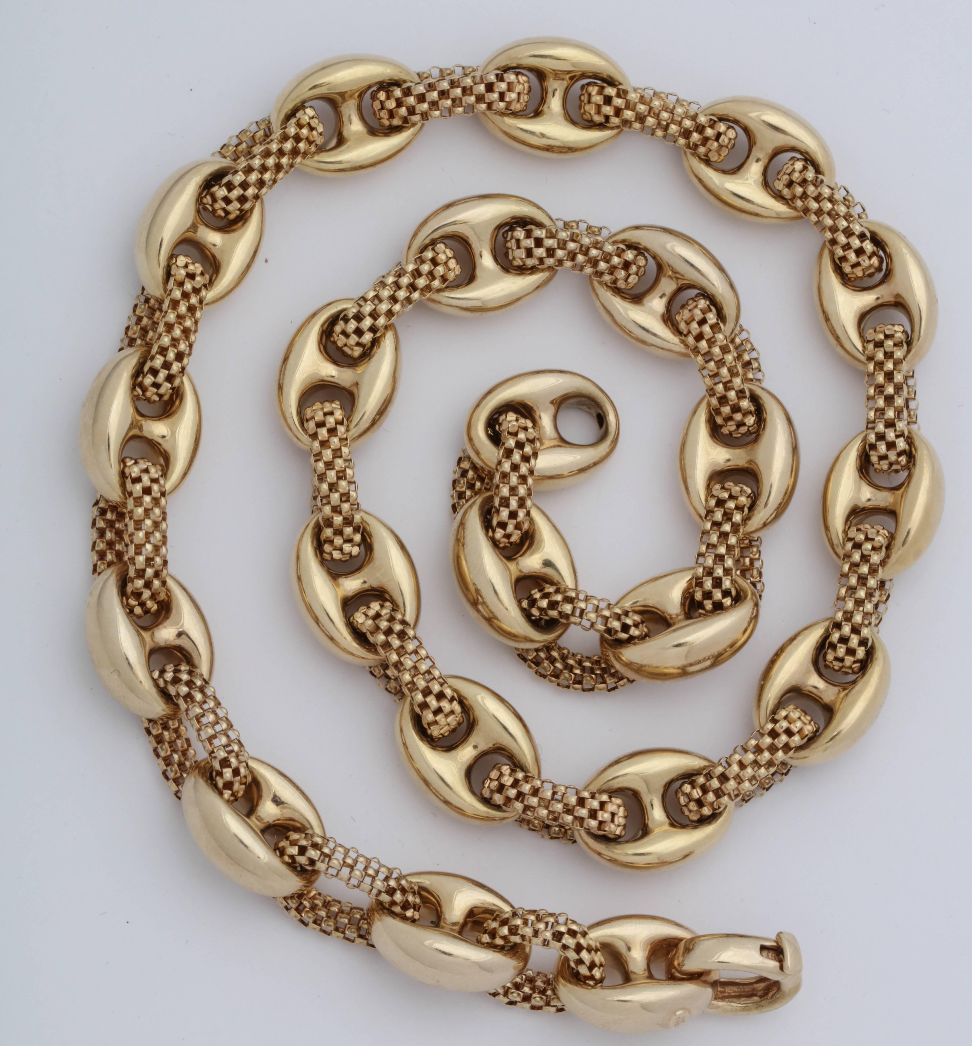One Unisex 14kt Yellow Gold Intertwined Link Chain Necklace Composed Of Two different Textures Of Gold : One Link Is In The Shape Of A High Polish Anchor Style Link And The Other Link Is Made Of a Three Dimensional Box Link Creating A Unique Ultra