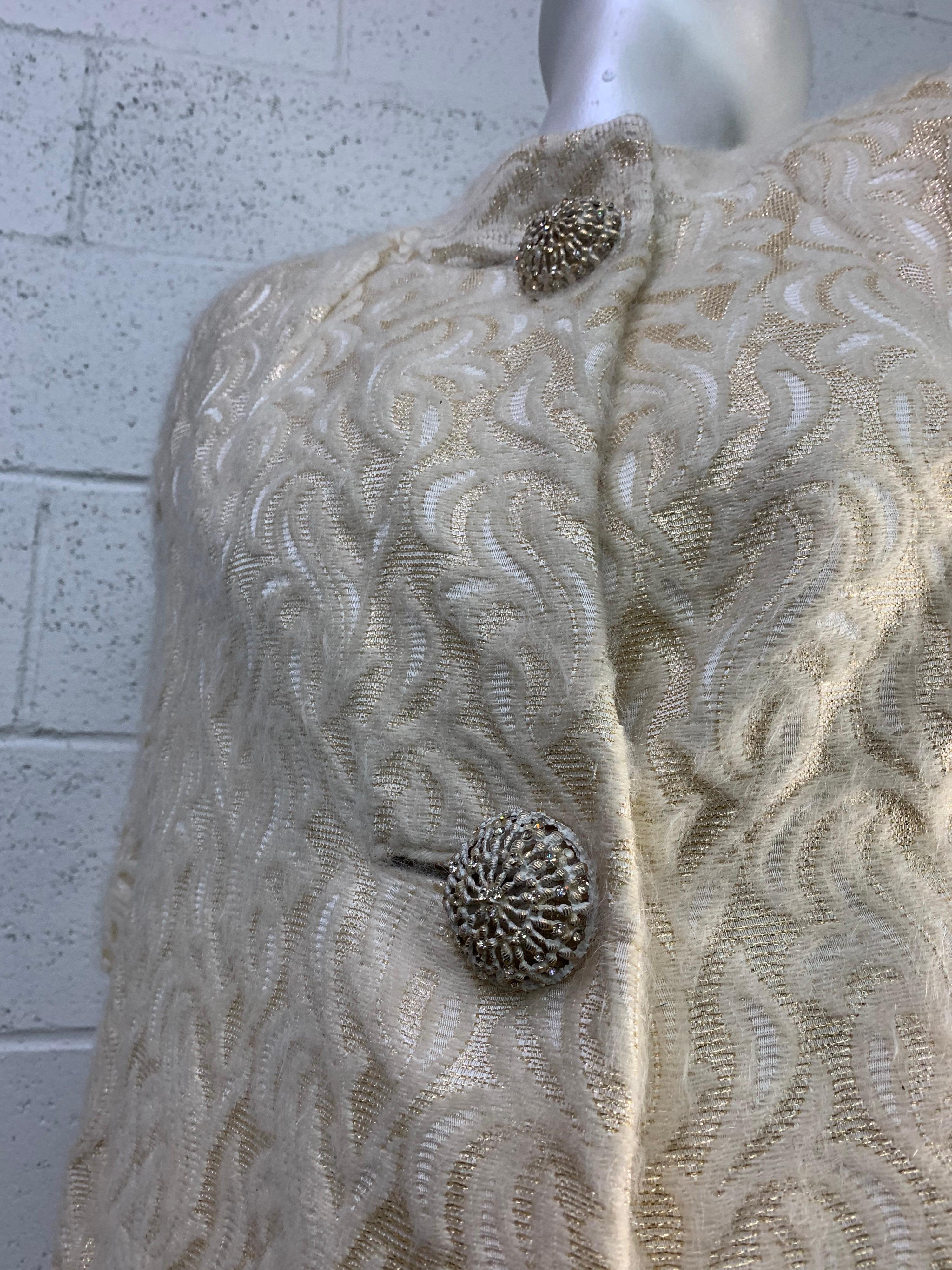 A beautiful 1960s Ira Rentner gold lame and mohair brocade spring coat cut in a Mod silhouette with filigree buttons at neckline. Fully lined. Size 6-8. 