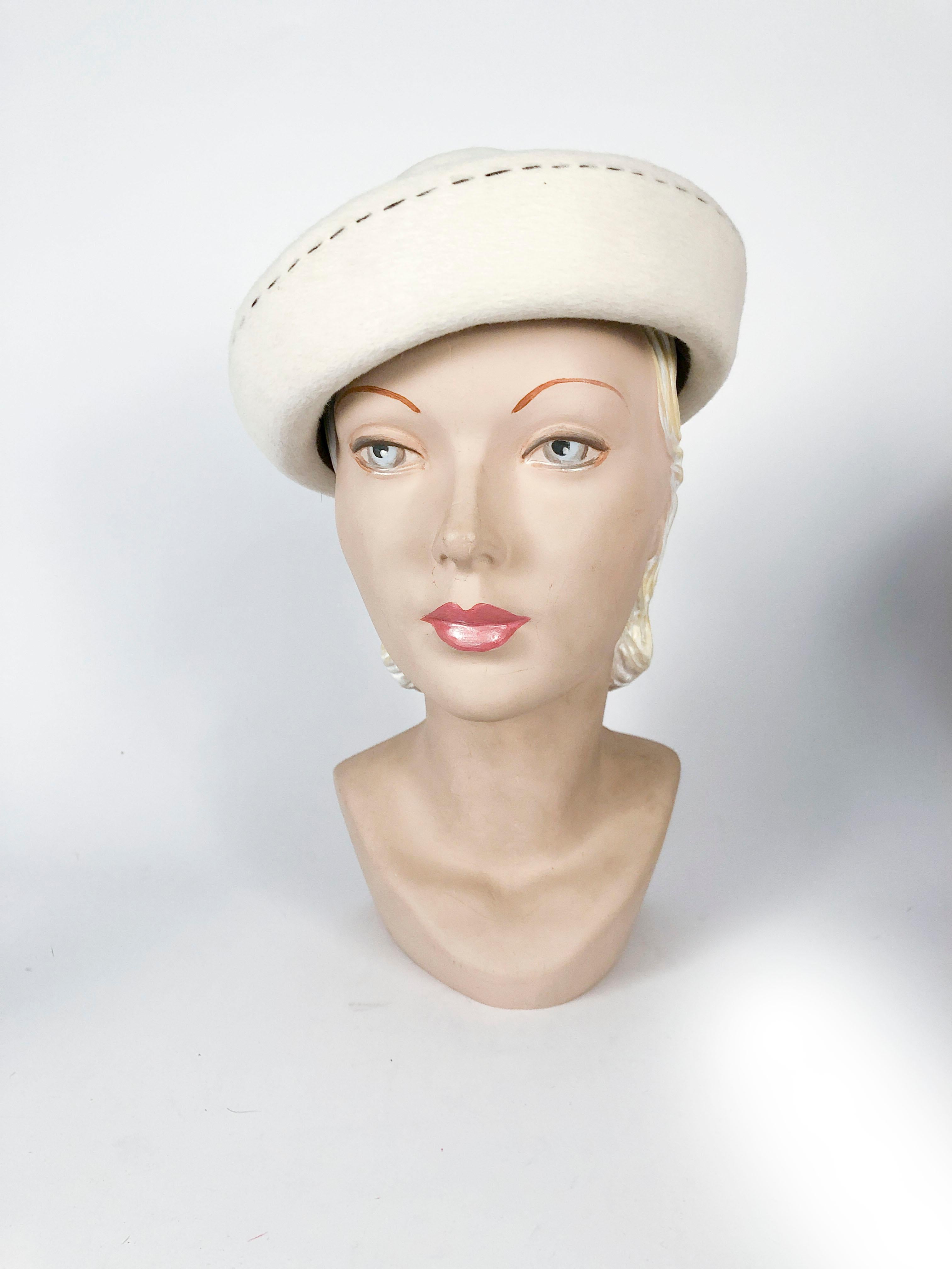 1960s Irene of New York cream colored sculpted fur felt hat with contrasting brown topstitching. The fur felt is very soft and a high quality felt made in France. 