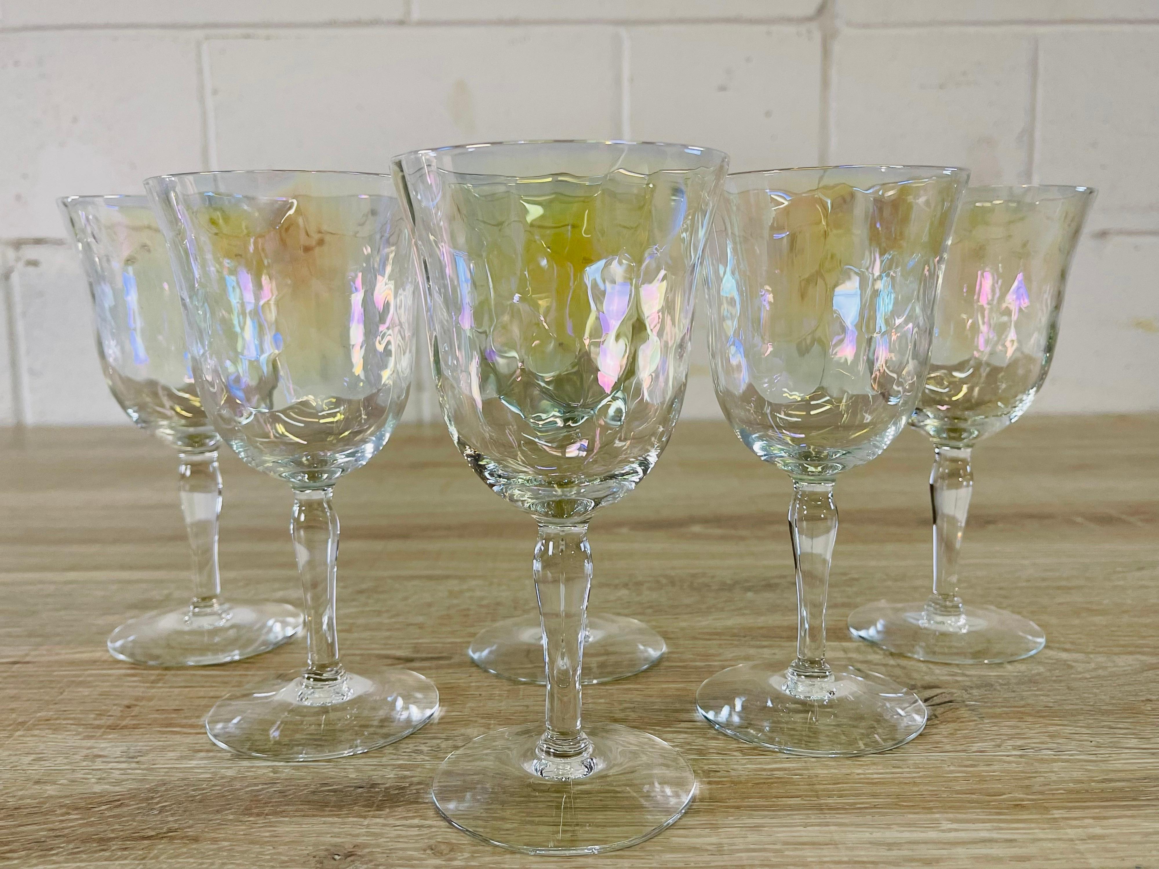 Vintage 1960s set of six iridescent glass wine stems with a swag design. No marks.