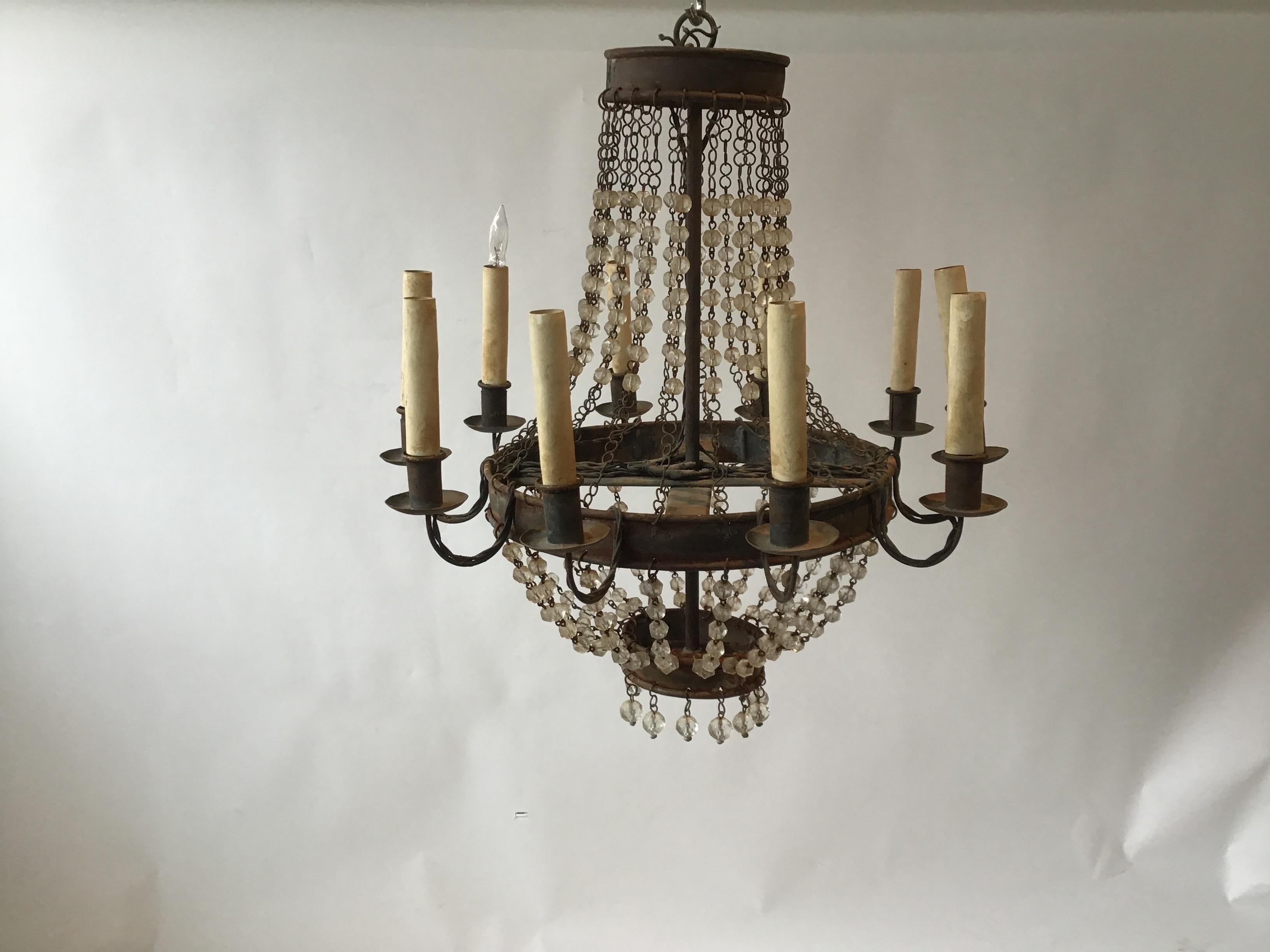 1960s iron and crystal chandelier. Some rust on metal. Has almost an industrial look to it.