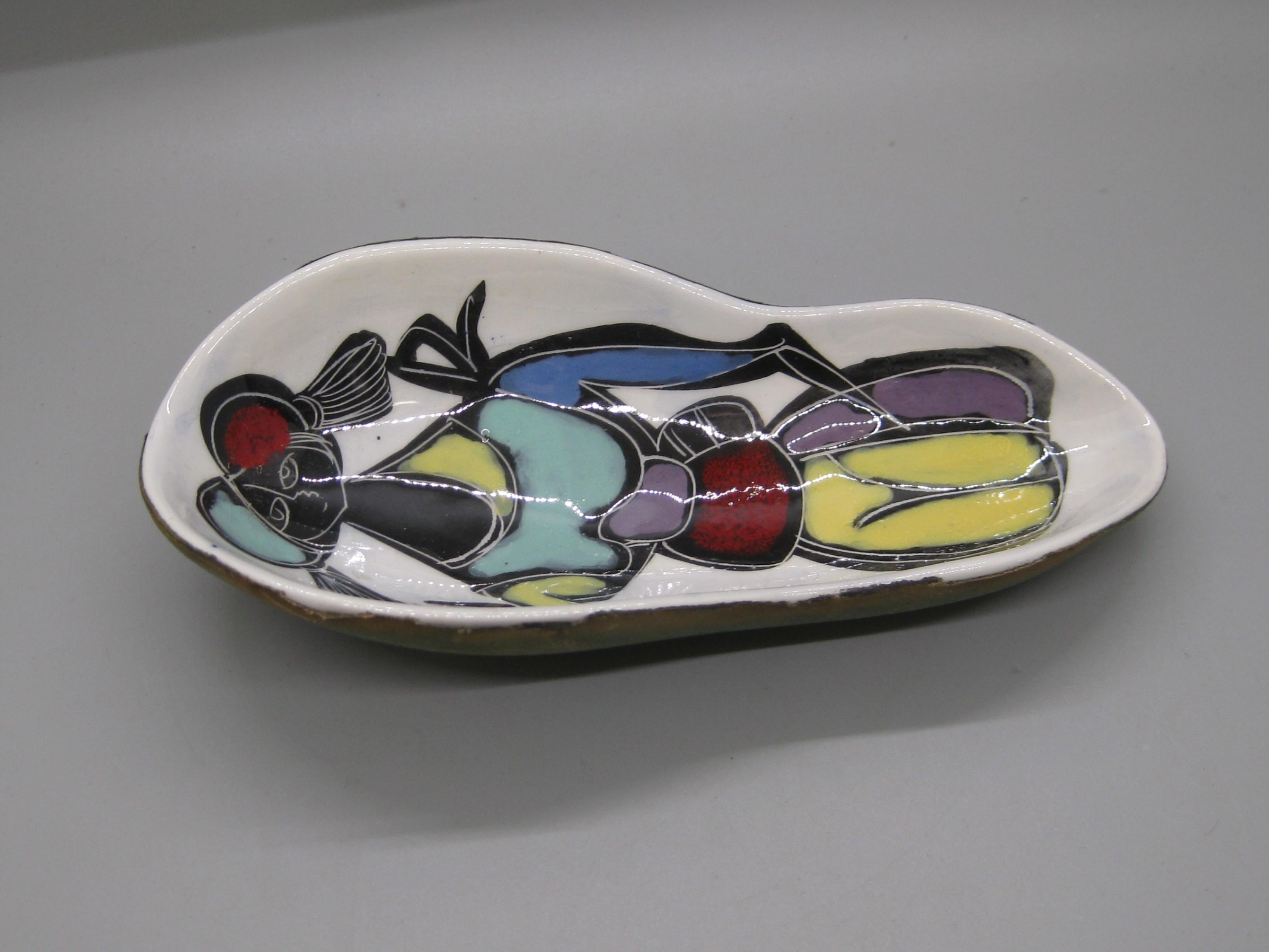 Wonderful vintage Italian leather wrapped ceramic/pottery dish/low bowl, circa 1960's. Attributed to Guido Gambone. Made in Italy and is signed on the bottom. Great hand painted abstract woman figure form and design. Wonderful hand painted colors.