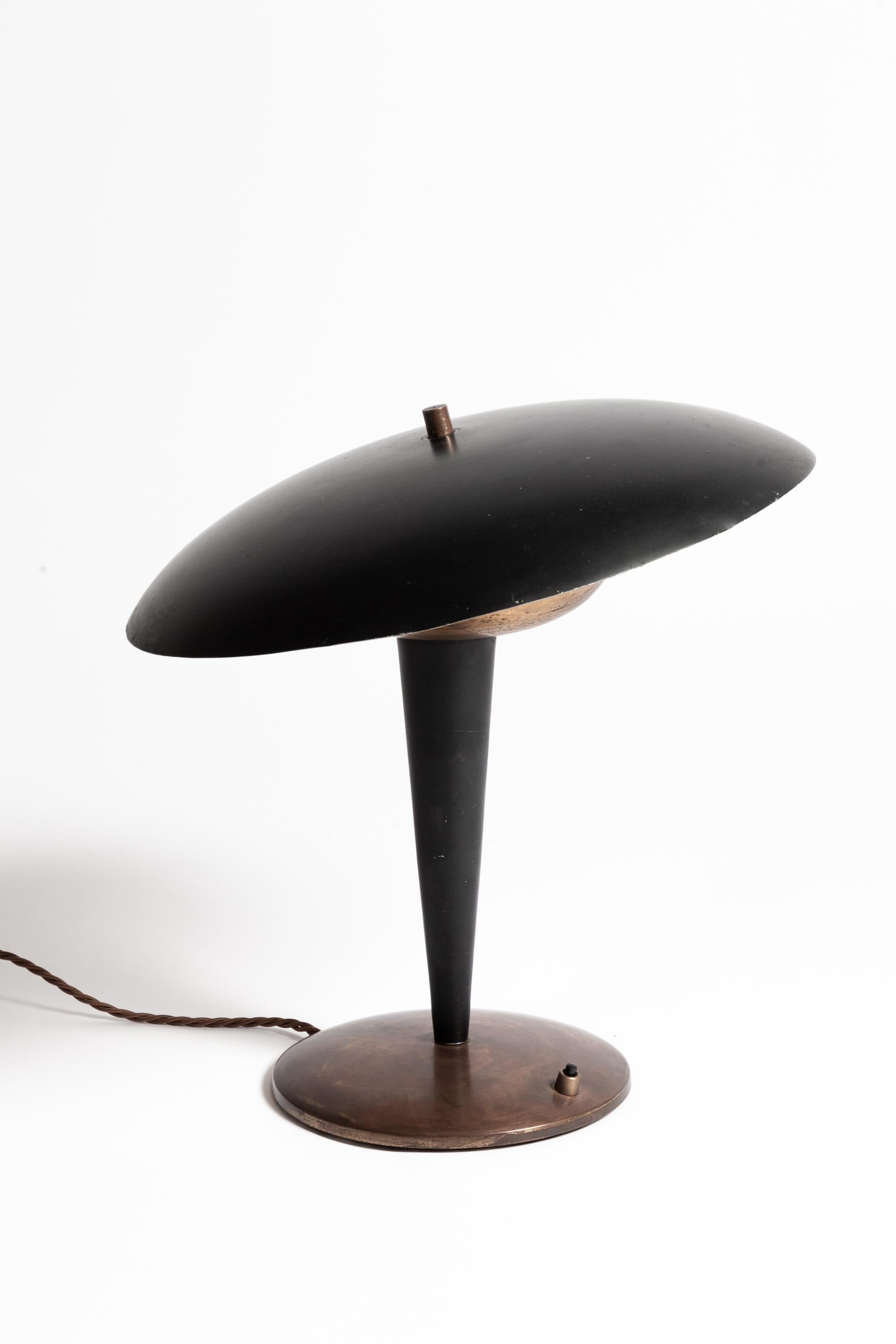 A 1960s Italian Desk Lamp. The domed shade is fully adjustable and casts a very nice down-light.

Lovely overall patina. Original black painted aluminium shade has minor age-associated scratches and marks commensurate with age. The brass elements