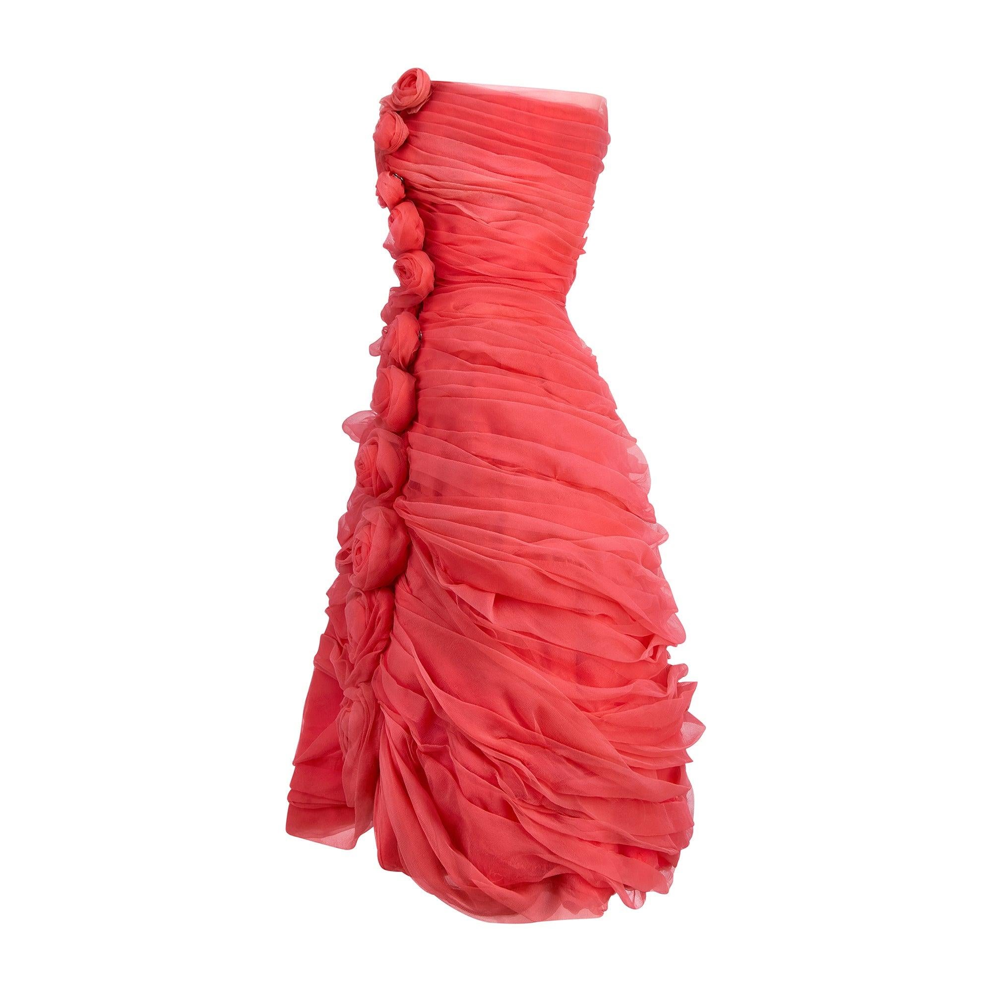 This romantic chiffon gown is Italian couture, known as 'Alta Moda', and was made in the very late 1950s to early 1960s. The piece is unlabelled, but we believe it references the famous Valentino 
