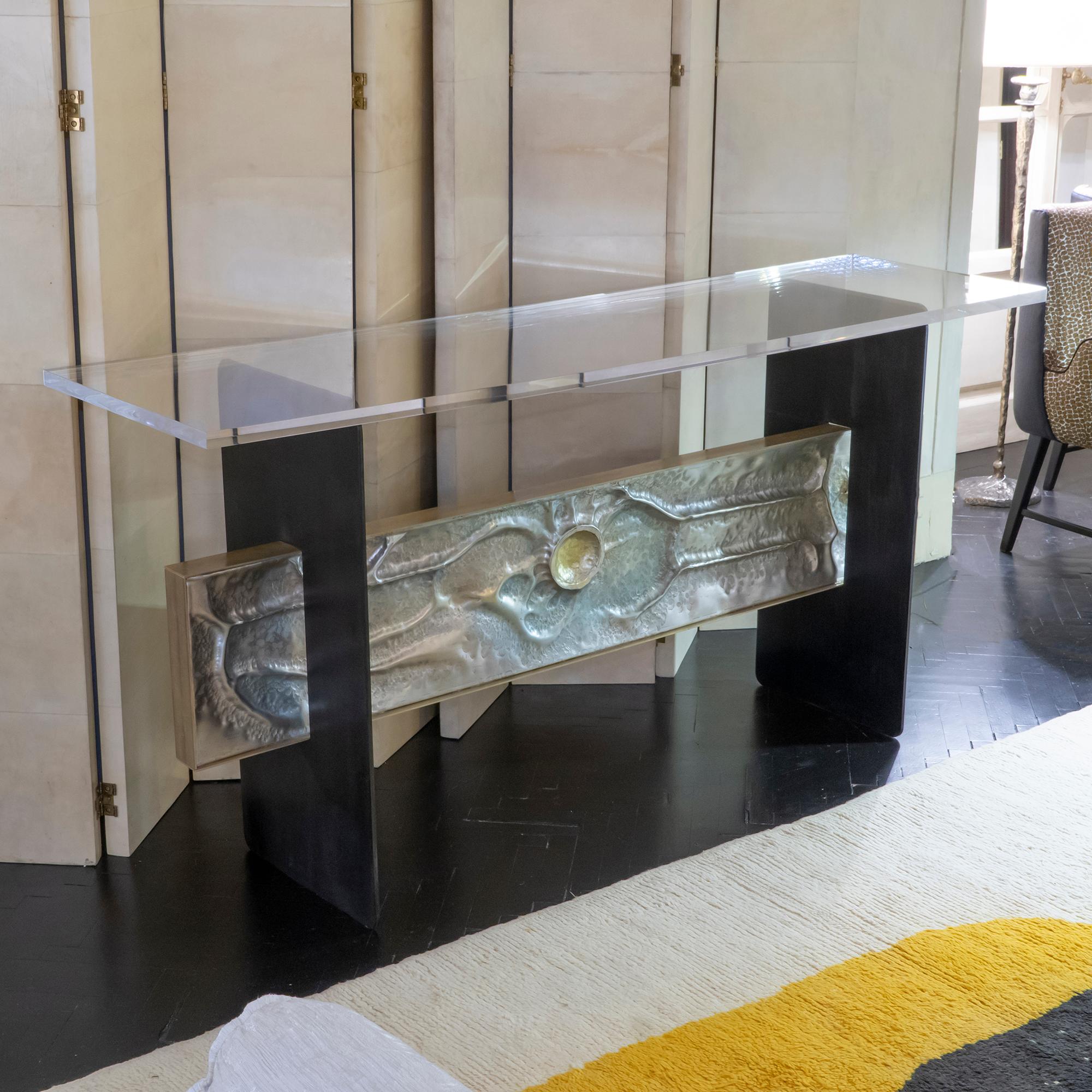 Console with dark grey steel structure and sculptural aluminum frieze, brass frame and transparent plexiglass top, Italy, 1960s.
