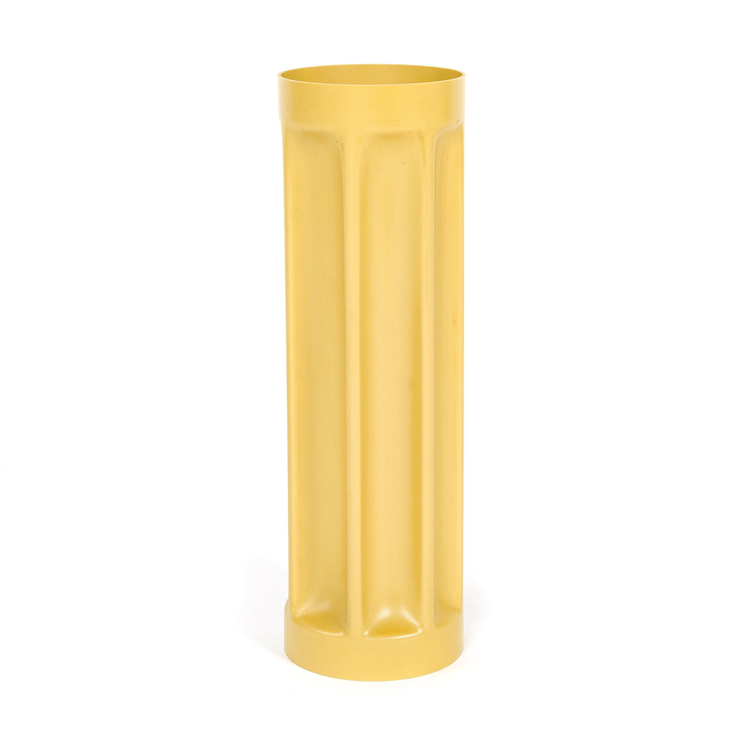 From the 'Bambu' series, a pressure-casted PVC vase in yellow ochre. Model 3084A.