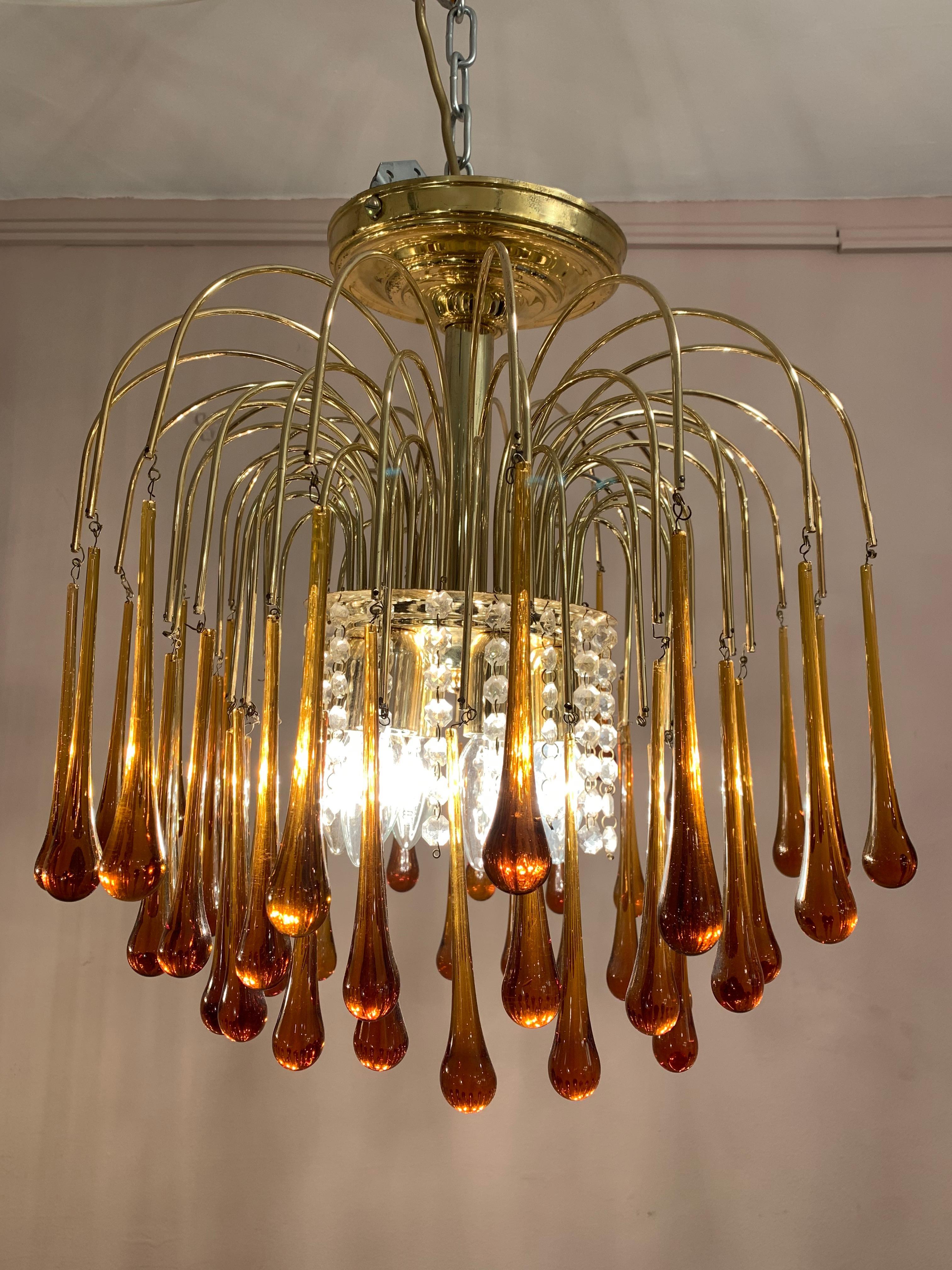 Vintage 1960s Italian Murano, amber-glass, cascading, flushmount chandelier designed by Paolo Venini. There are three-tiers of amber glass teardrops suspended from brass waterfall stems.

Six E14 screw-in bulbs sit under the brass canopy at the