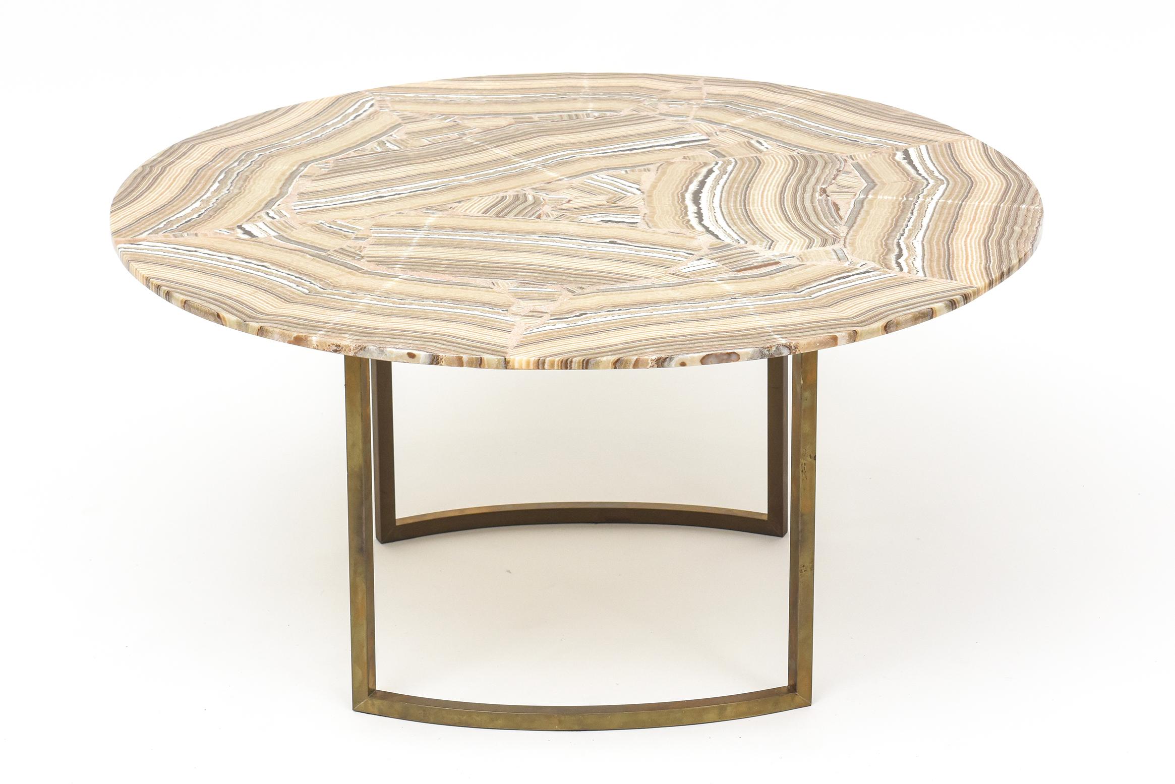 Gorgeous movement and rich coloring in this 1960s Italian onyx-topped cocktail table with warmly patinaed solid brass base. Simple, chic, and stunning!