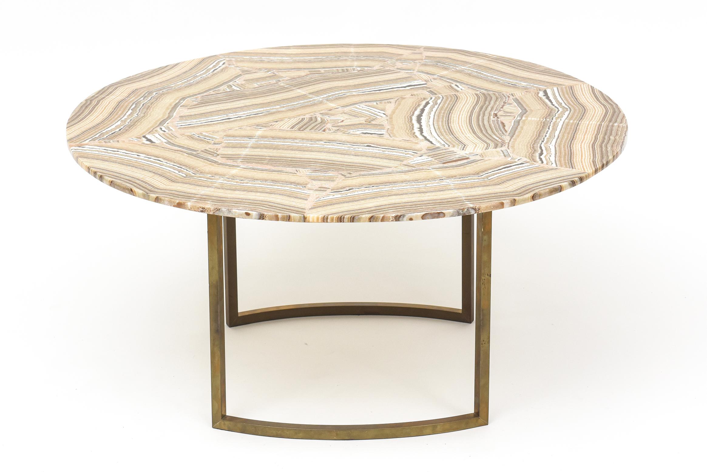 Gorgeous movement and rich coloring in this 1960s Italian onyx-topped cocktail table with warmly patinaed solid brass base. Simple, chic, and stunning!