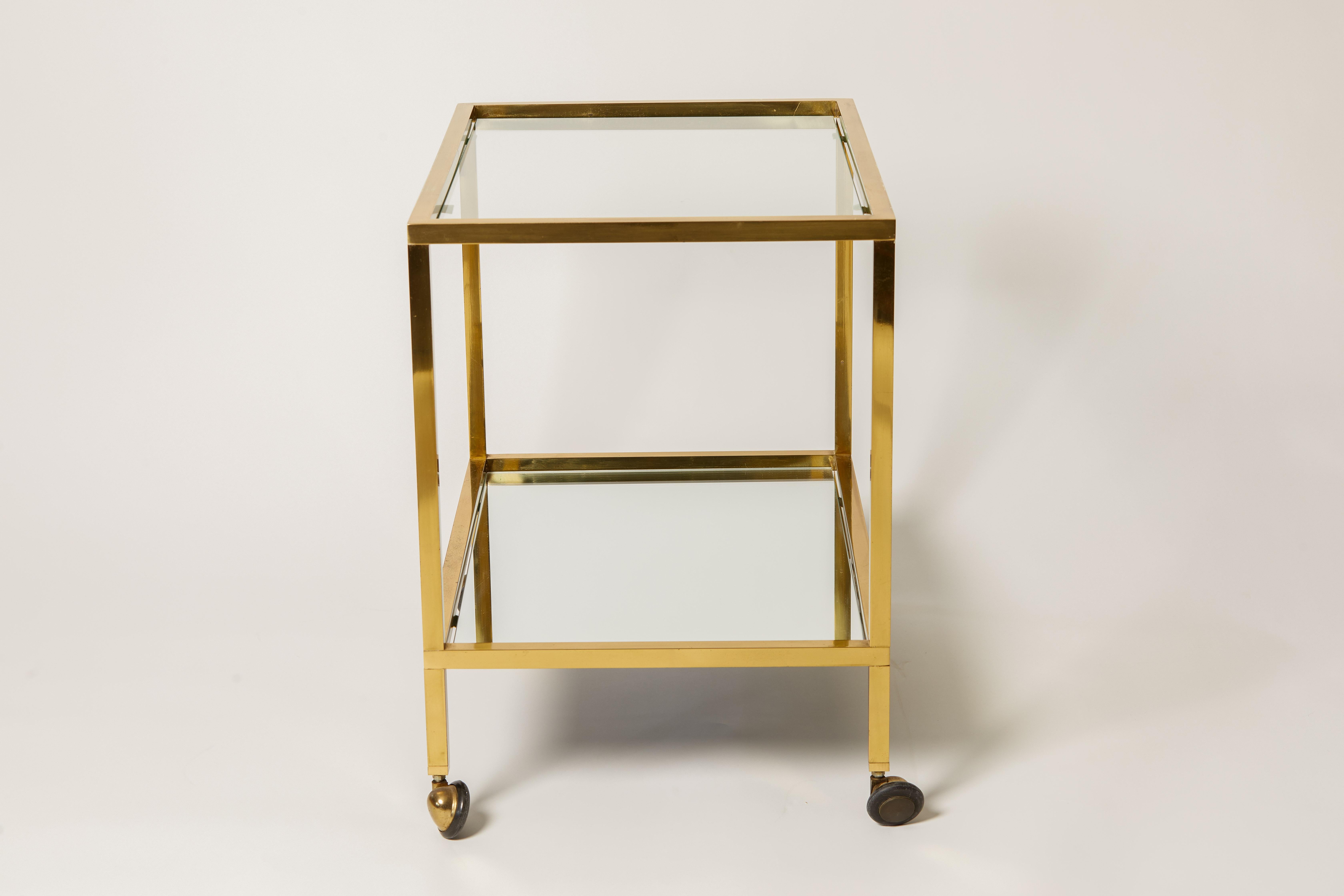 1960s Italian Brass, Glass & Mirror Bar Cart. Top shelf is glass and bottom shelf is mirror. The wheels on cart are not removable.
