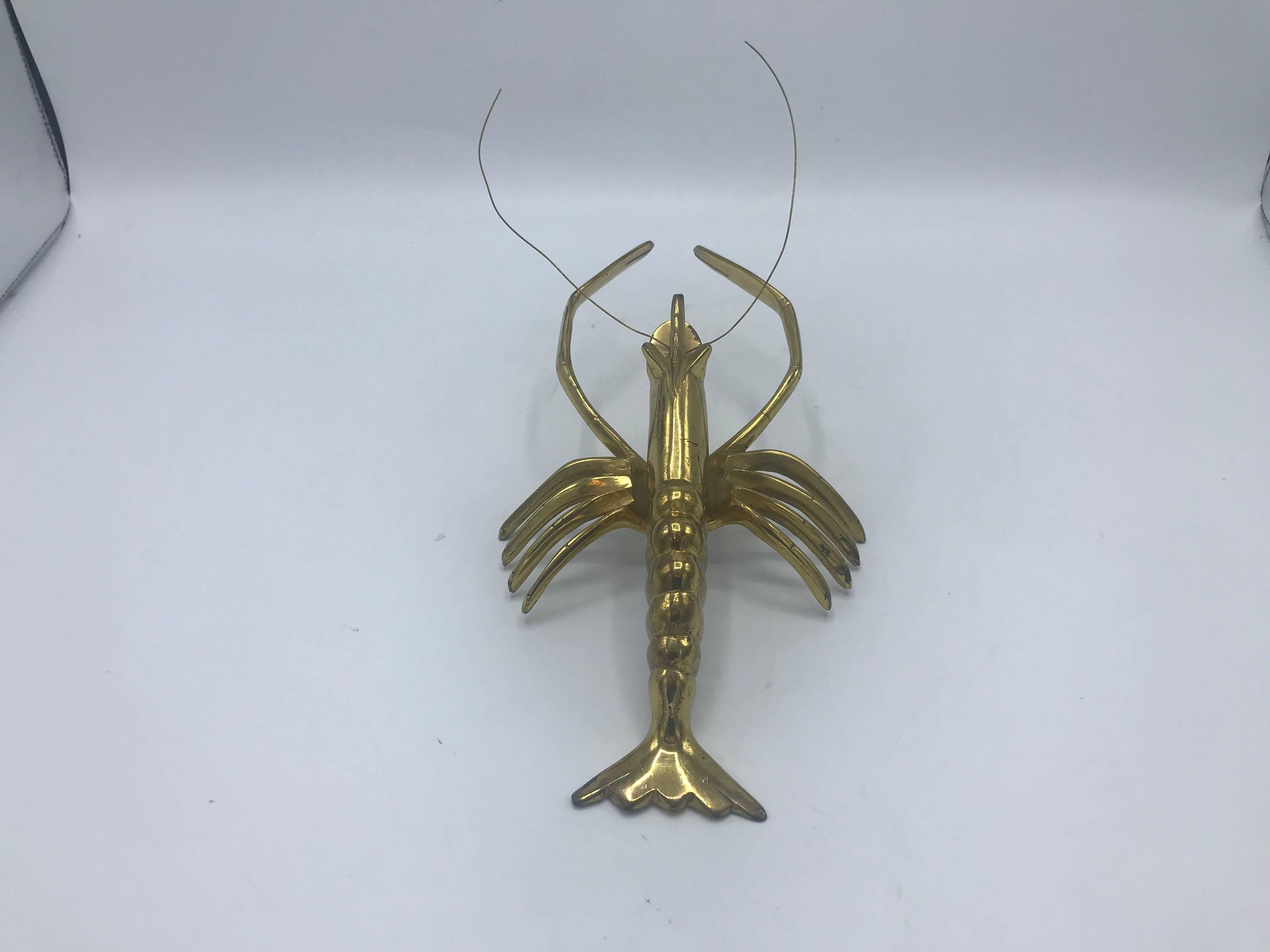 Offered is a beautiful, 1960s Italian brass lobster sculpture. The piece is fairly heavy for its size. Antennas can be moved, trimmed, or replaced.