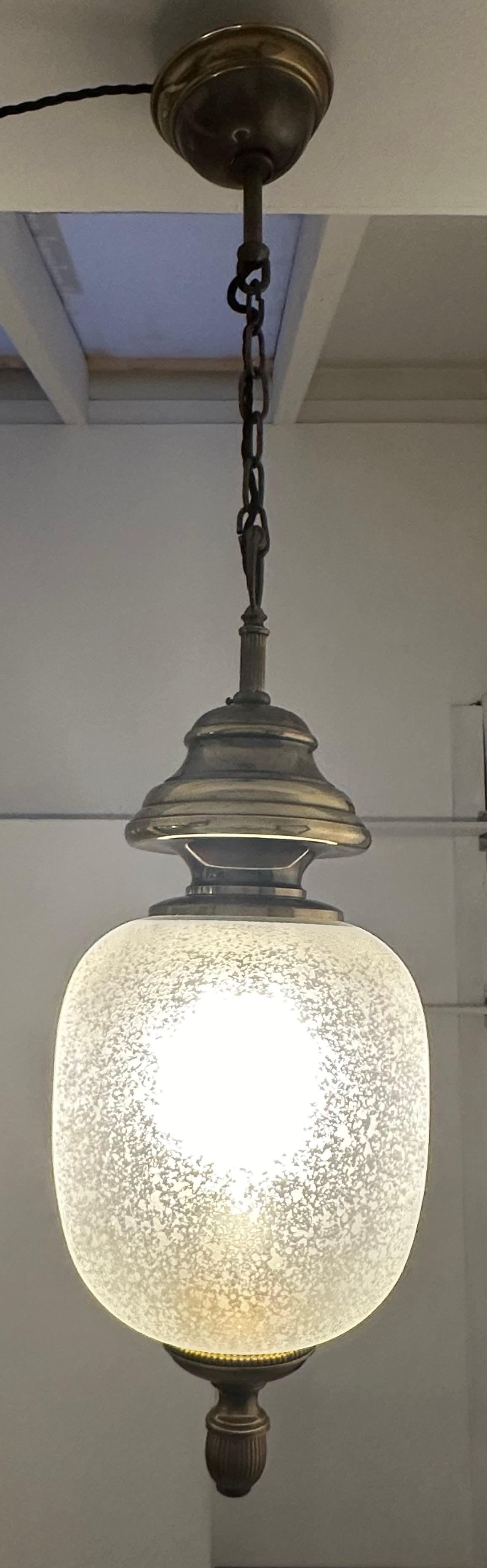 1960s Italian Murano glass and brass pendant lantern hanging ceiling light.  Designed by Gaetano Sciolari for Sciolari Lighting.  The Murano handblown glass oval shade has a beautiful engraved mottled patterned surface with amoeba shaped frosted