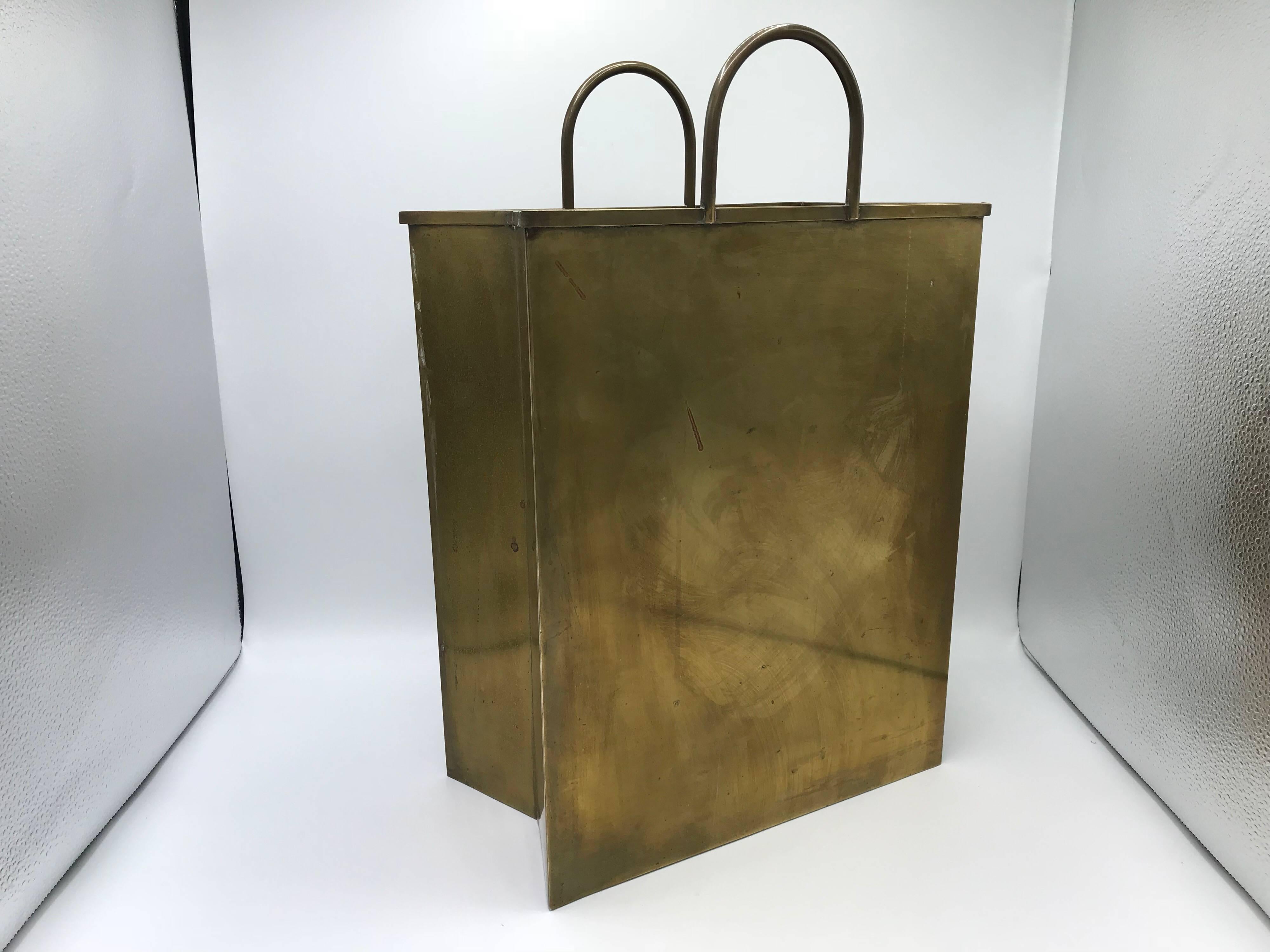 Offered is a fabulous, large 1960s Italian Sarreid Ltd. brass shopping bag cachepot planter. The piece is perfect as a wastebin or umbrella stand! Marked ‘Made in Italy’ on underside, see last photo.