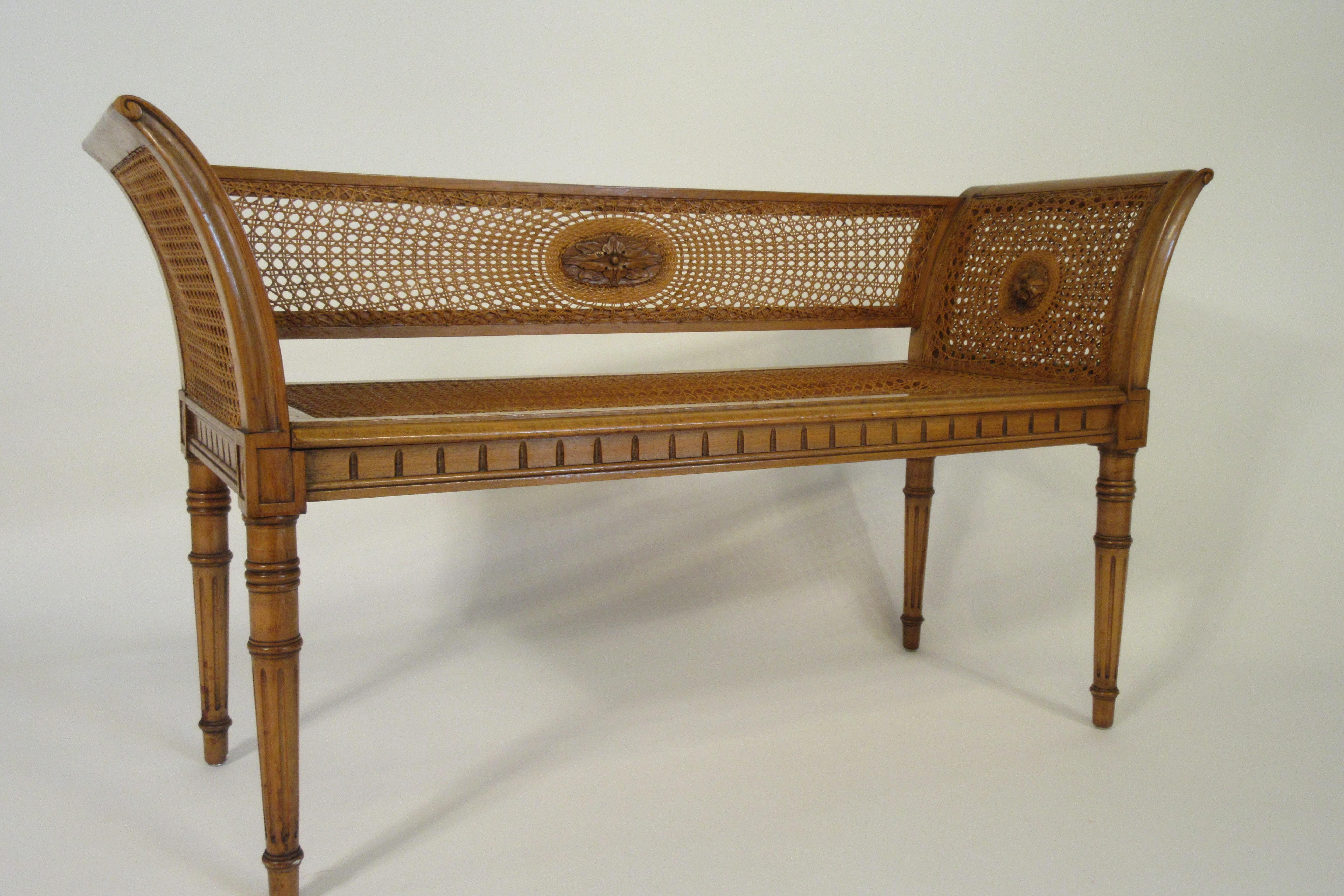 1960s Italian caned bench with wood medallion. The and the right side of the bench needs to be re caned.