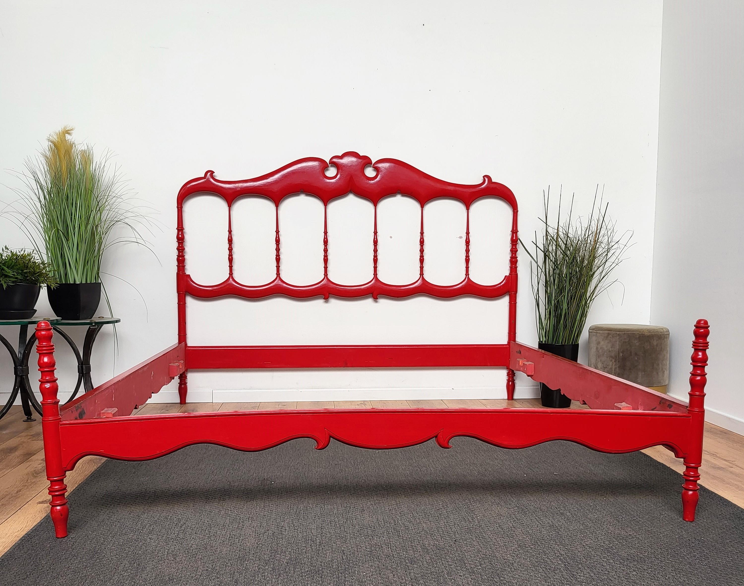 Imprssive 1960s Italian Chiavari bed frame in carved wood with great shiny red lacquer vintage patina and perfect long lasting solid structure. Chiavari style, mainly known for the chairs, is named after the Italian city where they originated, a