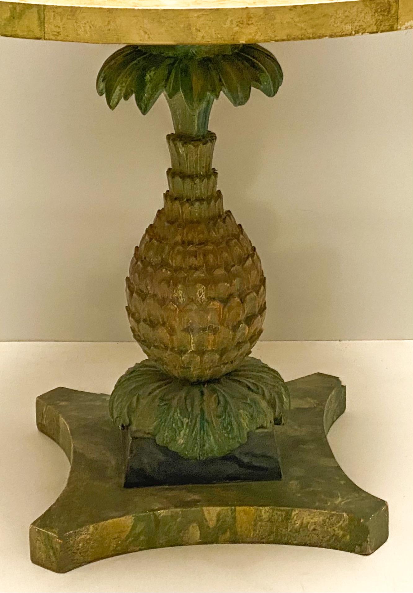 This is an Italian cast plaster pineapple base center table with faux marble painted wood top. It dates to the 1960s.