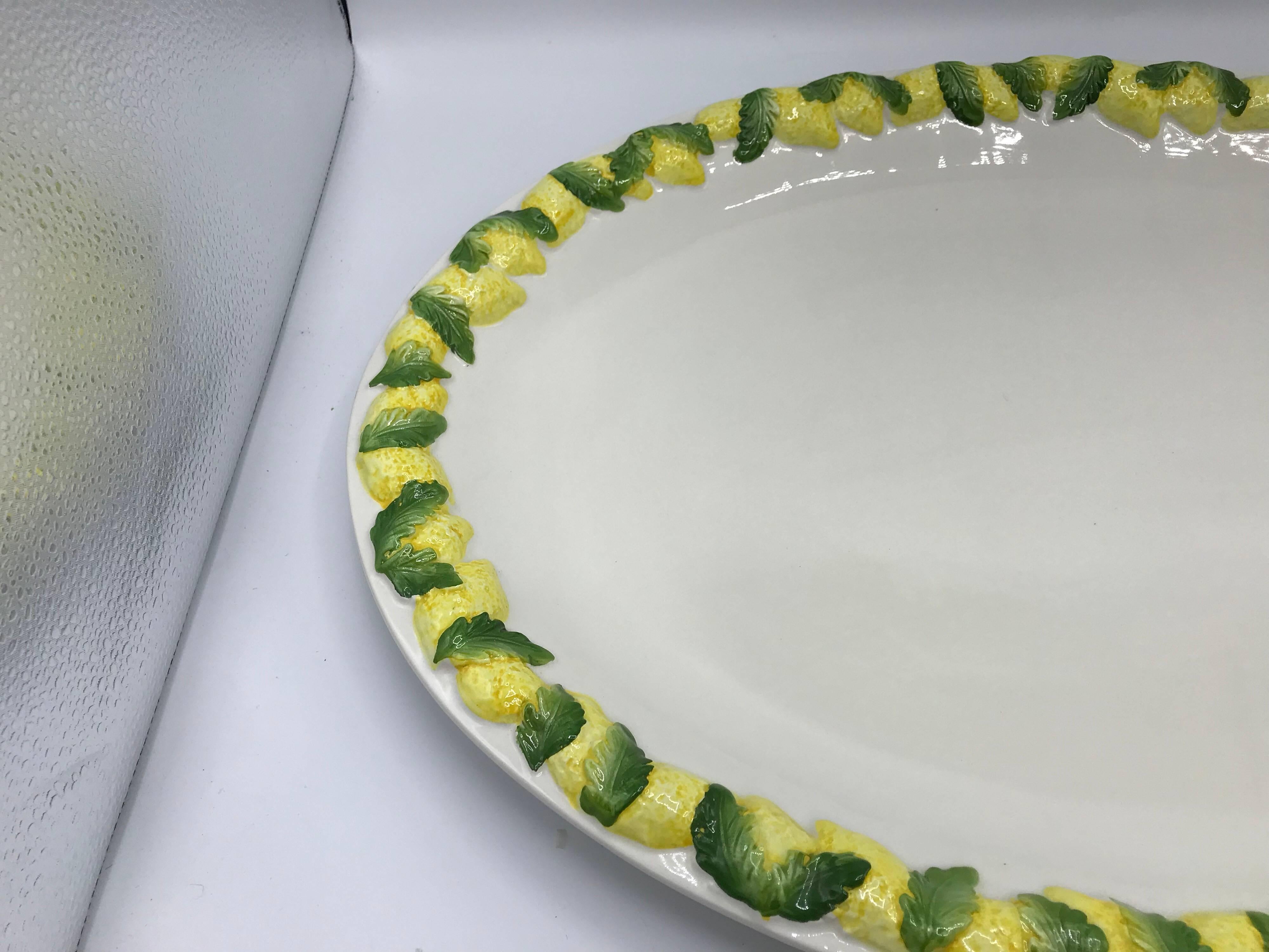 Listed is a stunning, 1960s Italian ceramic serving tray or platter. The piece has a gorgeous, sculptural lemon motif along the border. Heavy. Marked ‘Made in Italy’ on backside (see last photo).