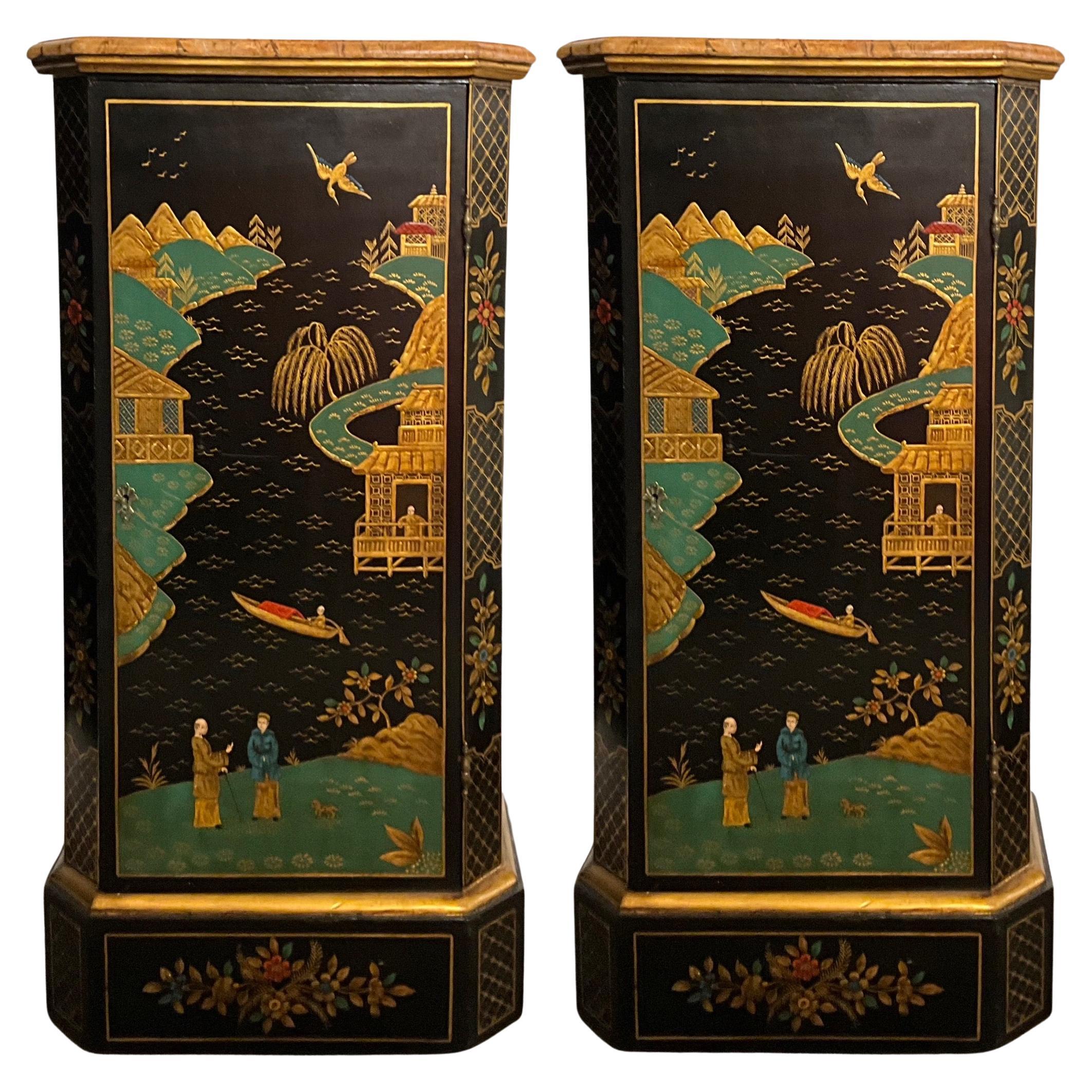 These are lovely. This is a pair of chinoiserie pedestals with a bright green / turquoise interior storage section. The tops and bases are hand painted in a faux marble. The body is black with chinoiserie pastoral scenes and gilt accents. They are