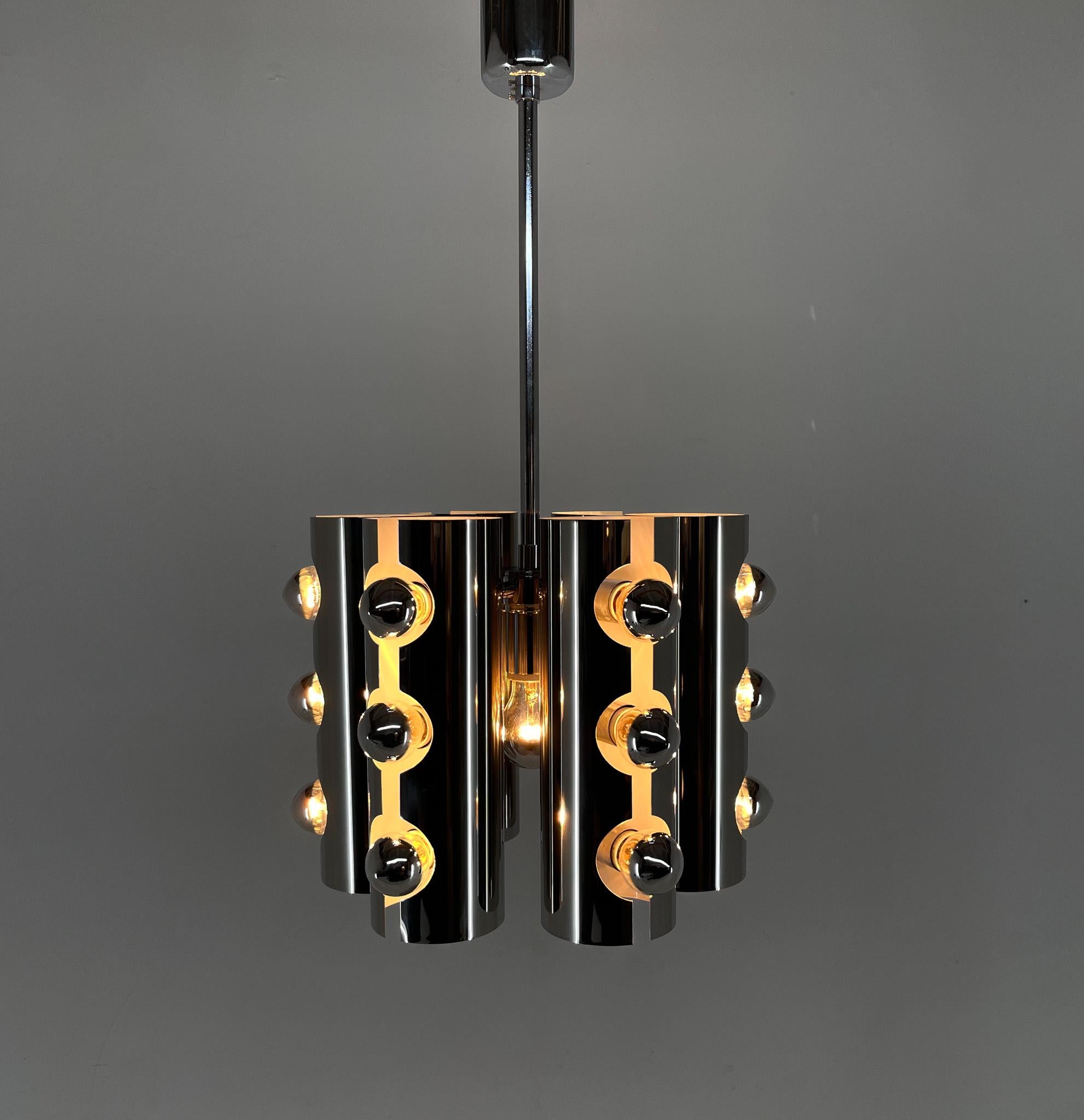 Beautiful chrom chandelier in style of the Italian designer Gaetano Sciolari. Made in Italy in the 1960's. Very good vintage condition. New wiring. Bulbs: 19 x E 14.