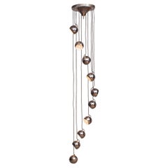 1960
s Italian Chromed with Ten Spherical Lights Cascade by Harvey Guzzini